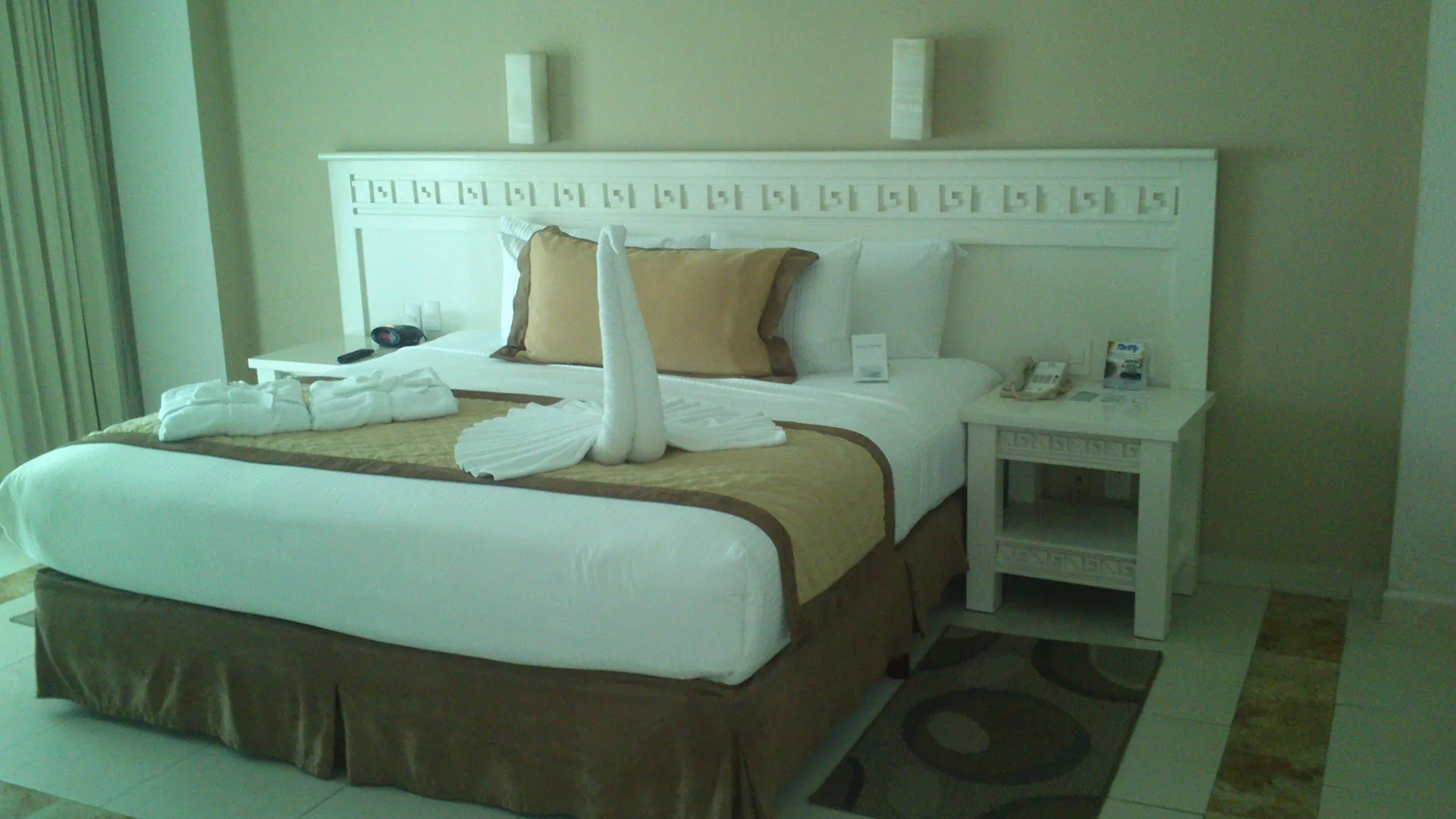 Deluxe Ocean View room with king bed and towel art at BlueBay Grand Esmeralda.