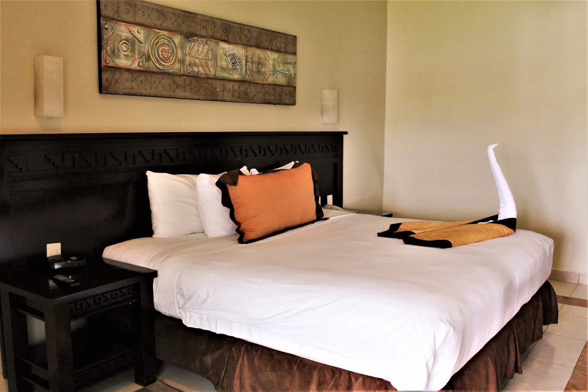 Deluxe Room with king bed and towel swan at BlueBay Grand Esmeralda.