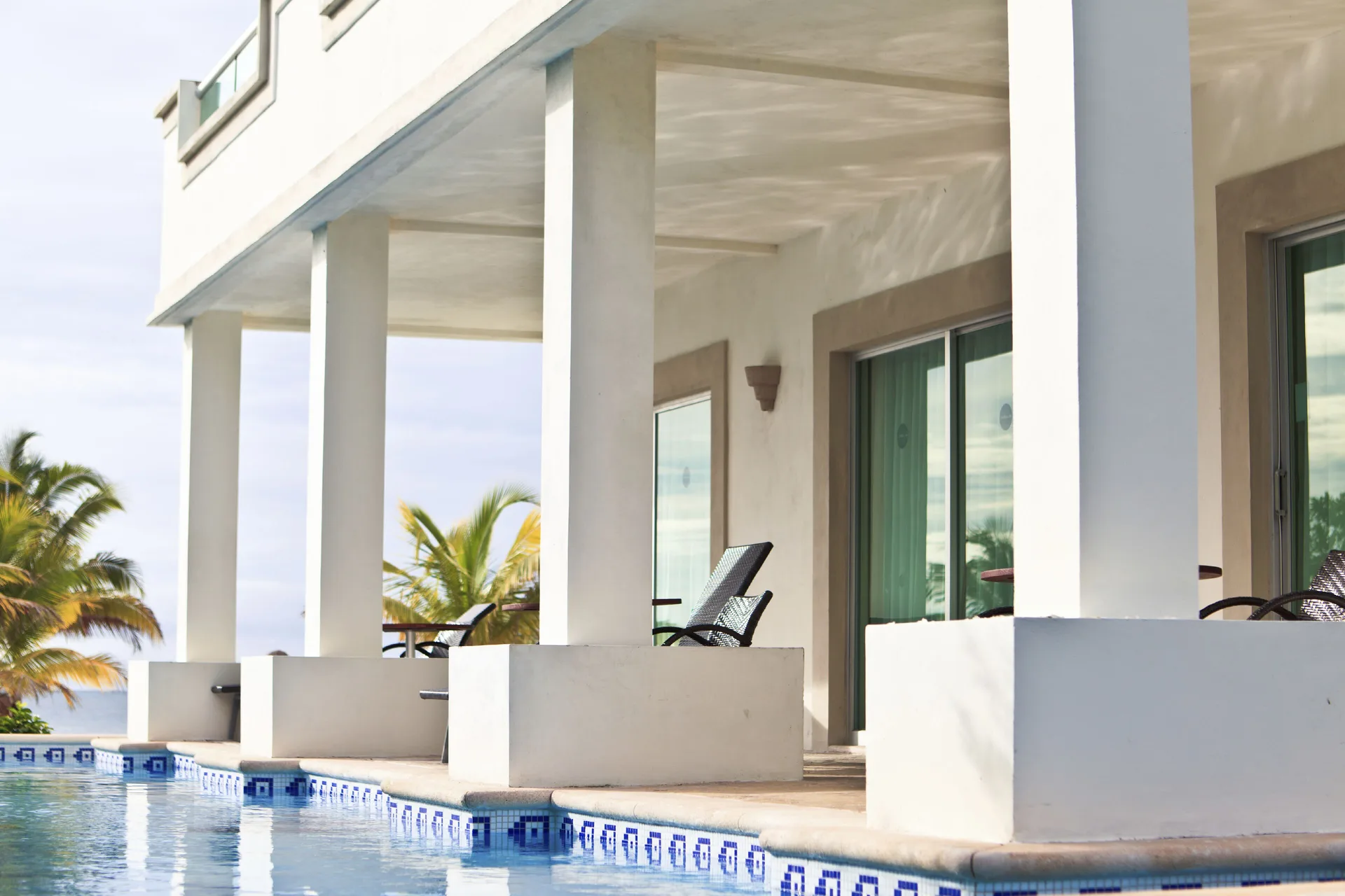 Pool access suite terraces line the water at BlueBay Grand Esmeralda.