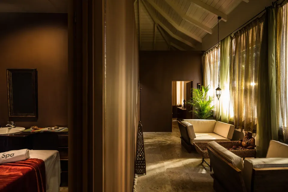 Spa treatment room and relaxation seating at BlueBay Villas Doradas.
