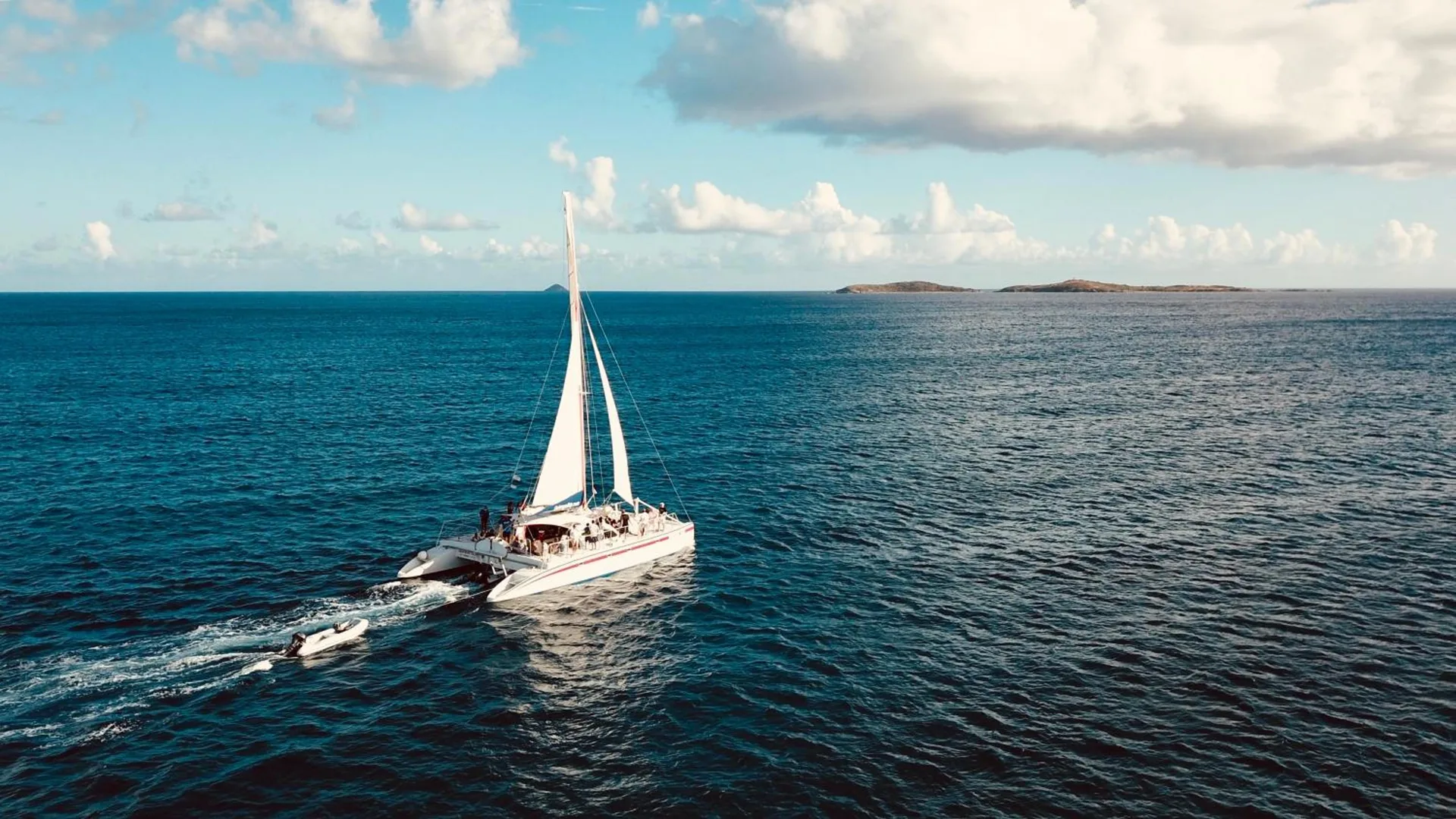 Catamaran sailing on blue Caribbean water near Bolongo Bay Beach Resort.