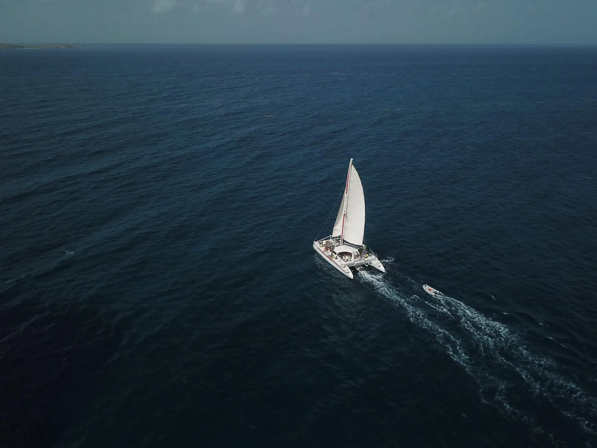 Catamaran sailing across deep blue water near Bolongo Bay Beach Resort.