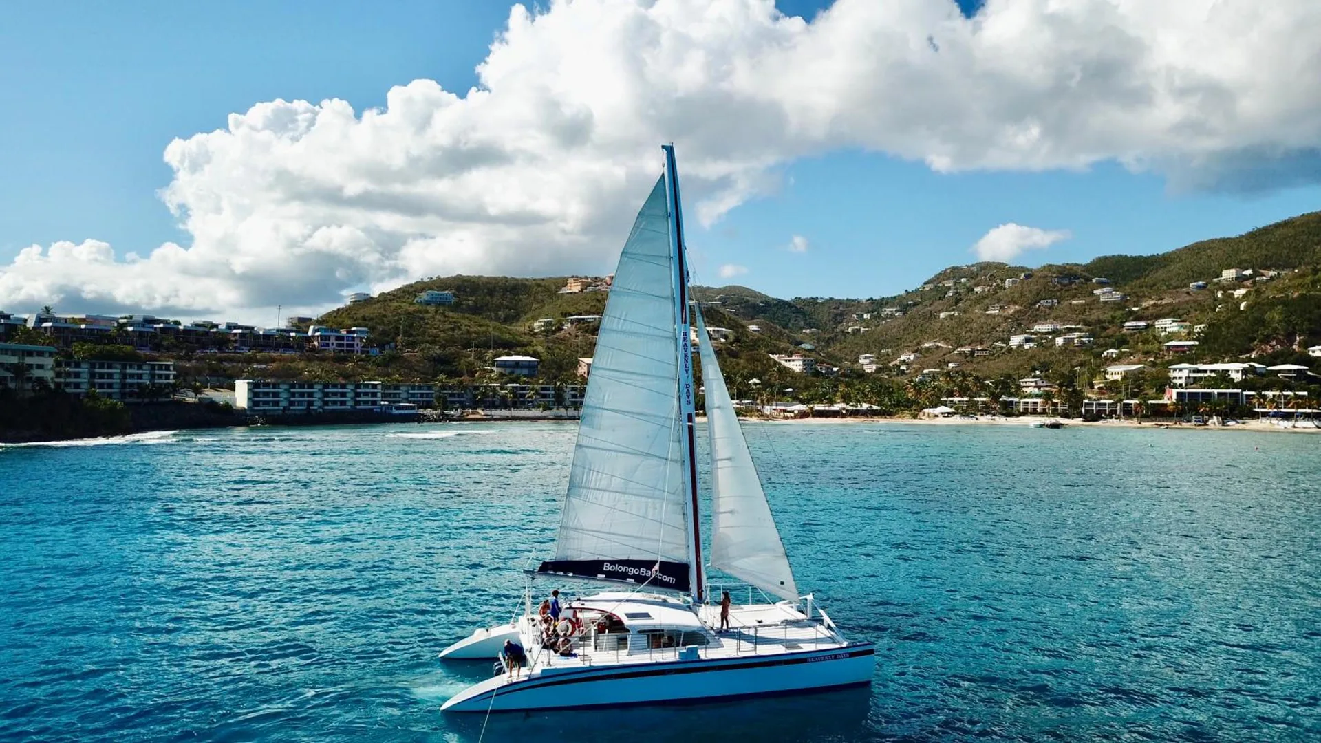 Catamaran anchored off the shoreline at Bolongo Bay Beach Resort.