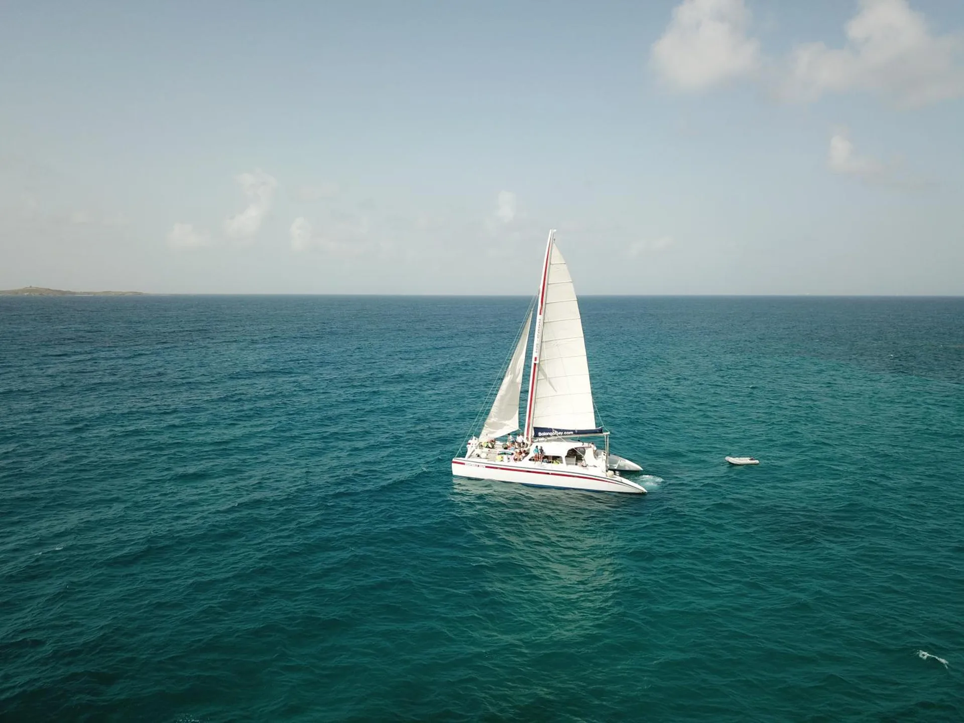 Sailboat on turquoise water near Bolongo Bay Beach Resort.