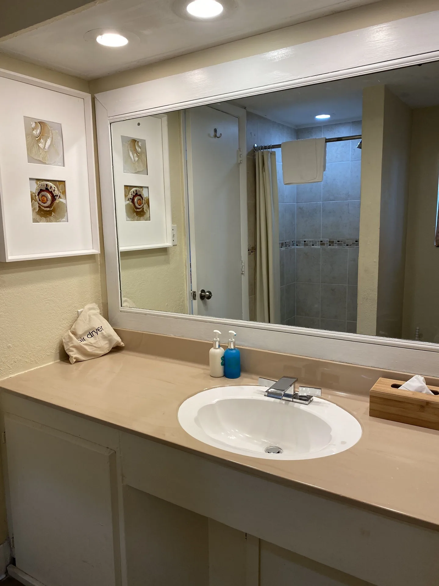 Guest room bathroom vanity and shower at Bolongo Bay Beach Resort.
