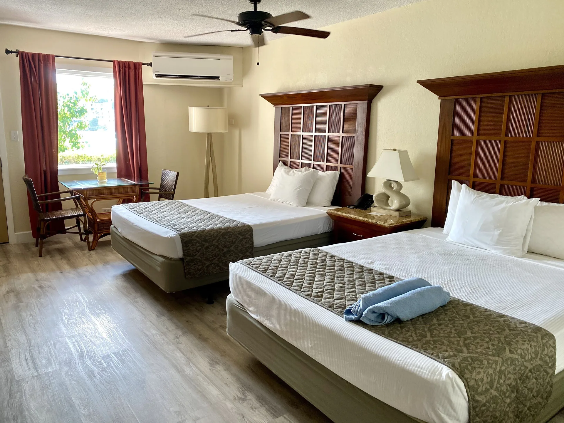 Two-bed guest room with window seating at Bolongo Bay Beach Resort.