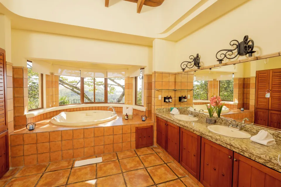 Junior Suite bathroom with soaking tub and dual sinks at Borinquen Thermal Resort.