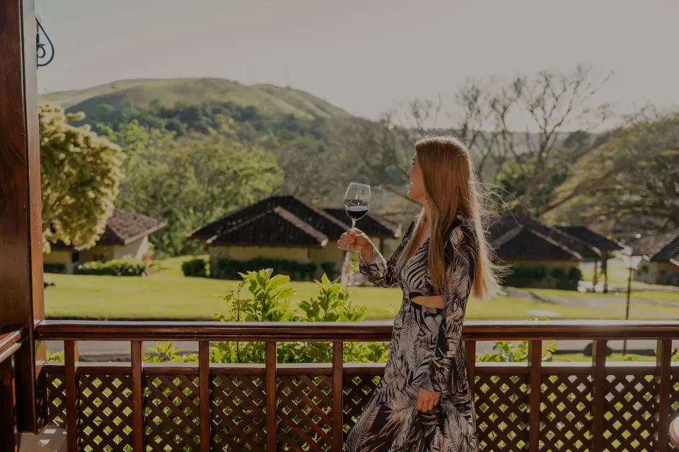 Standard Bungalow balcony view over gardens and hills at Borinquen Thermal Resort.