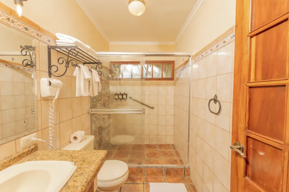 Villa Terrace Garden View bathroom with shower at Borinquen Thermal Resort.