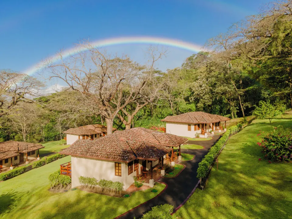 Garden villas and a rainbow over the grounds at Borinquen Thermal Resort.