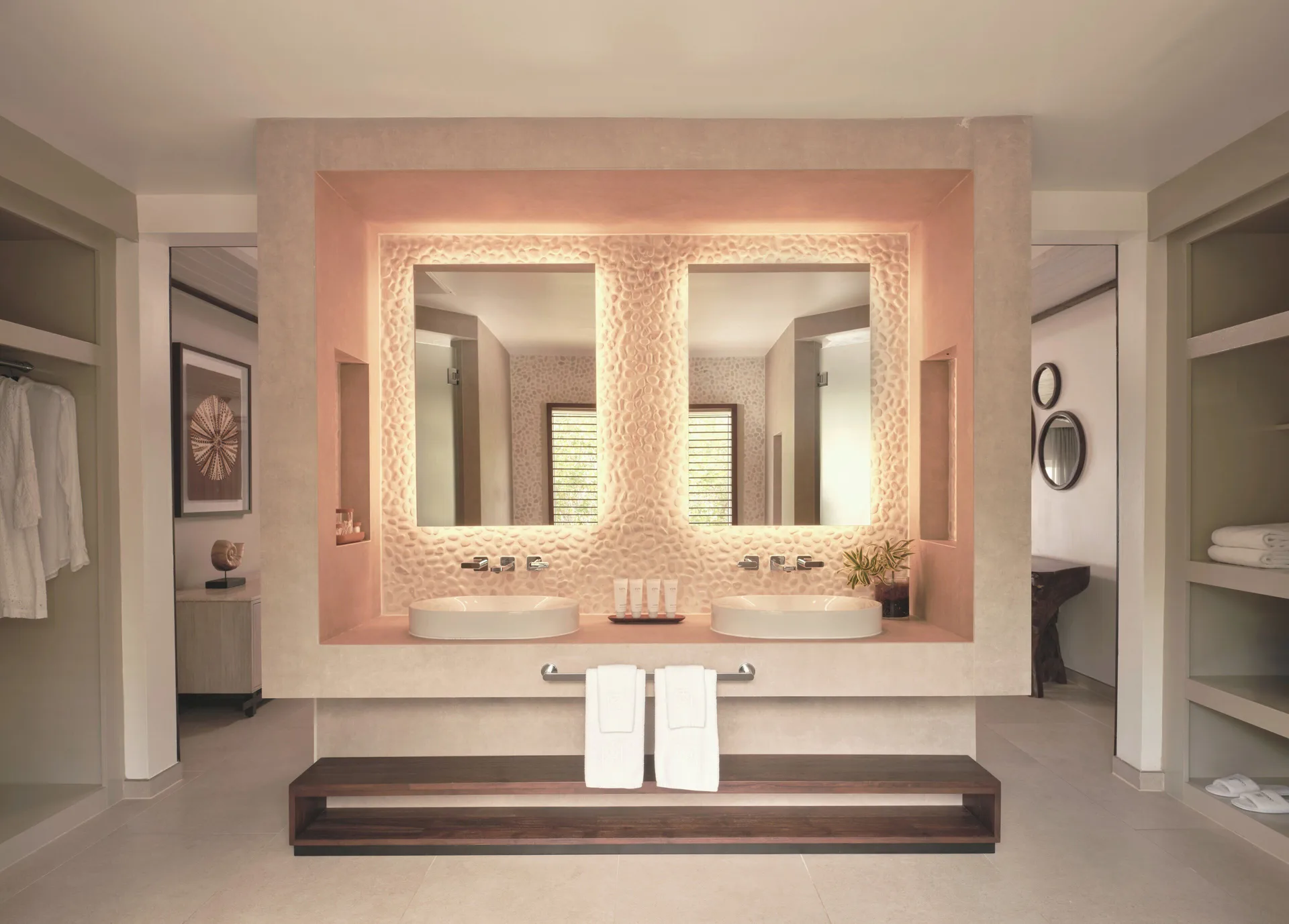 Garden Suite bathroom vanity with twin basins and illuminated mirrors at Carlisle Bay.
