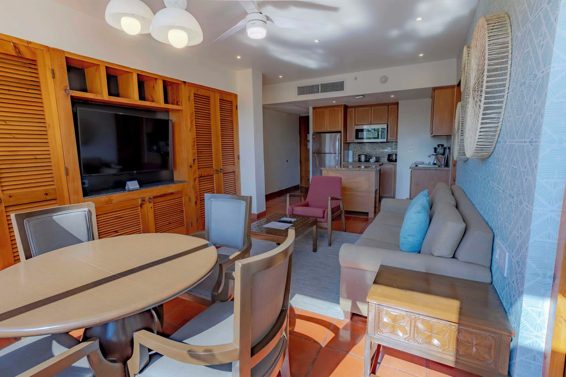 Deluxe suite living and dining area with kitchenette at Club Regina Puerto Vallarta.