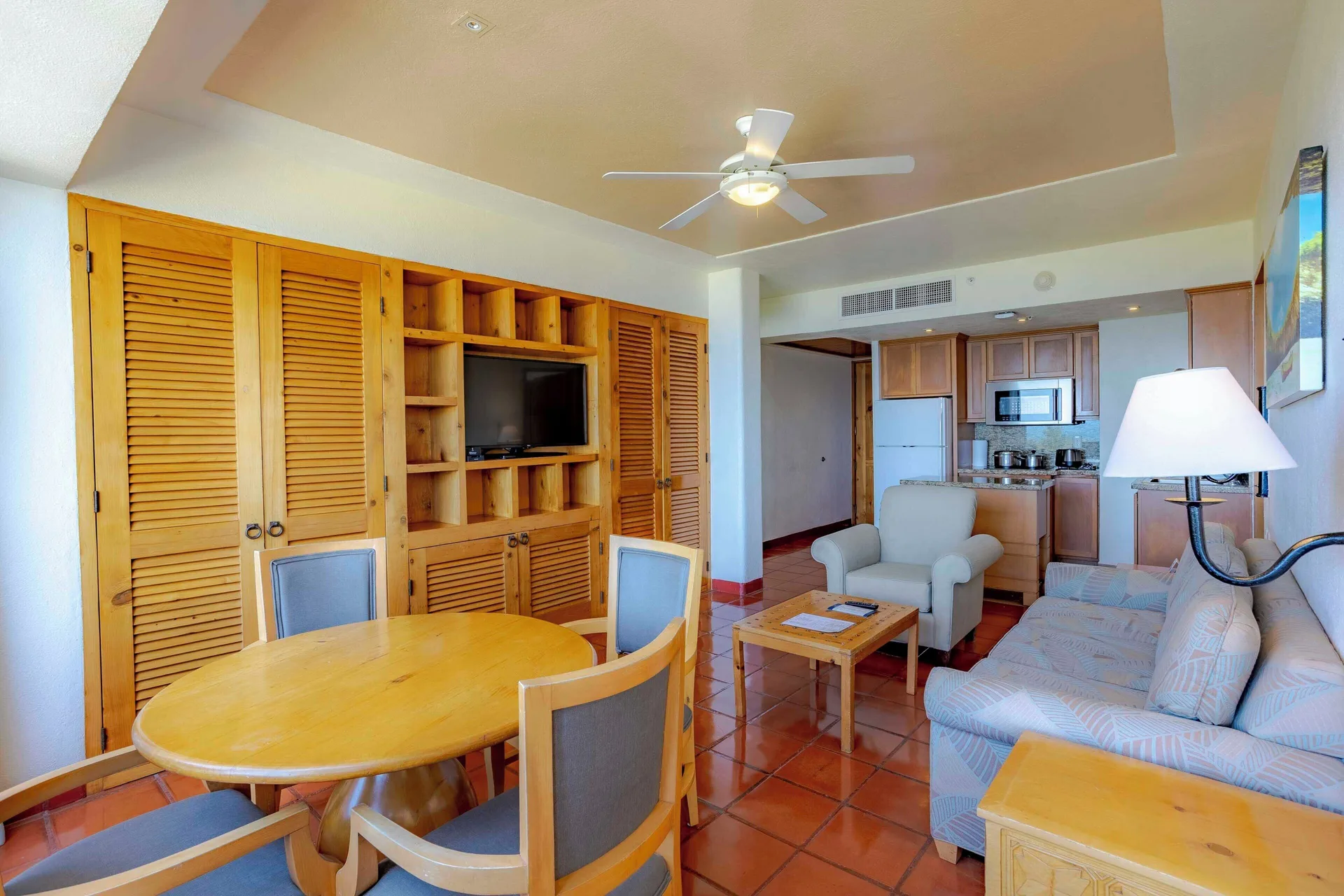 Suite living and dining area with kitchenette at Club Regina Puerto Vallarta.