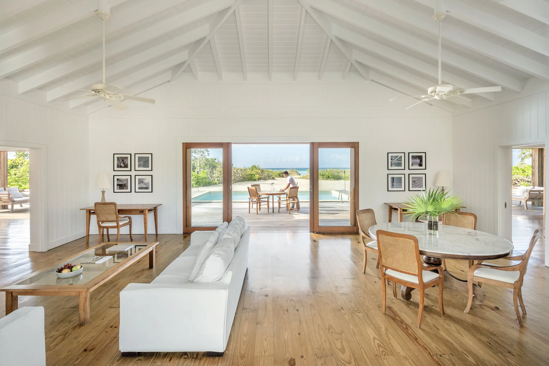 Beach House living and dining room with terrace beyond at COMO Parrot Cay.