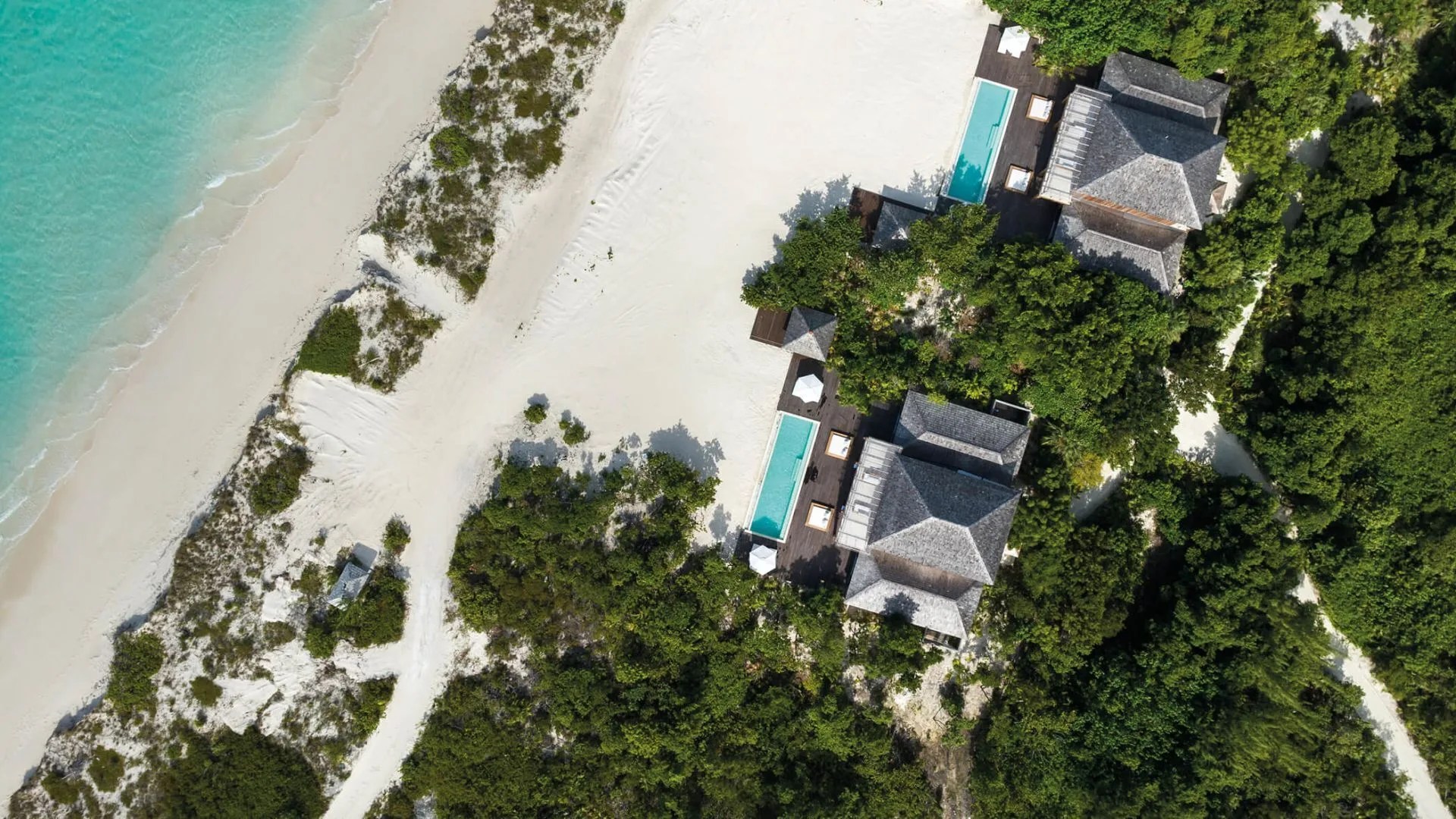 Aerial view of Como Villas with private pools beside the beach at COMO Parrot Cay.
