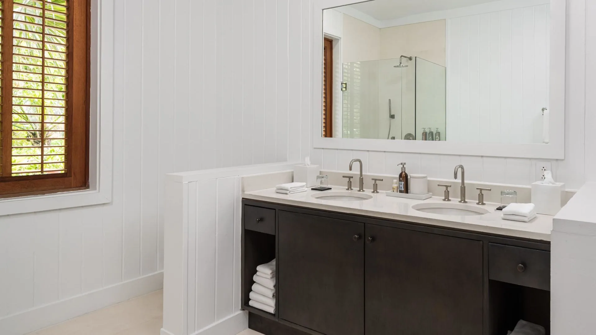 Beachfront Suite bathroom vanity with double sinks at COMO Parrot Cay.