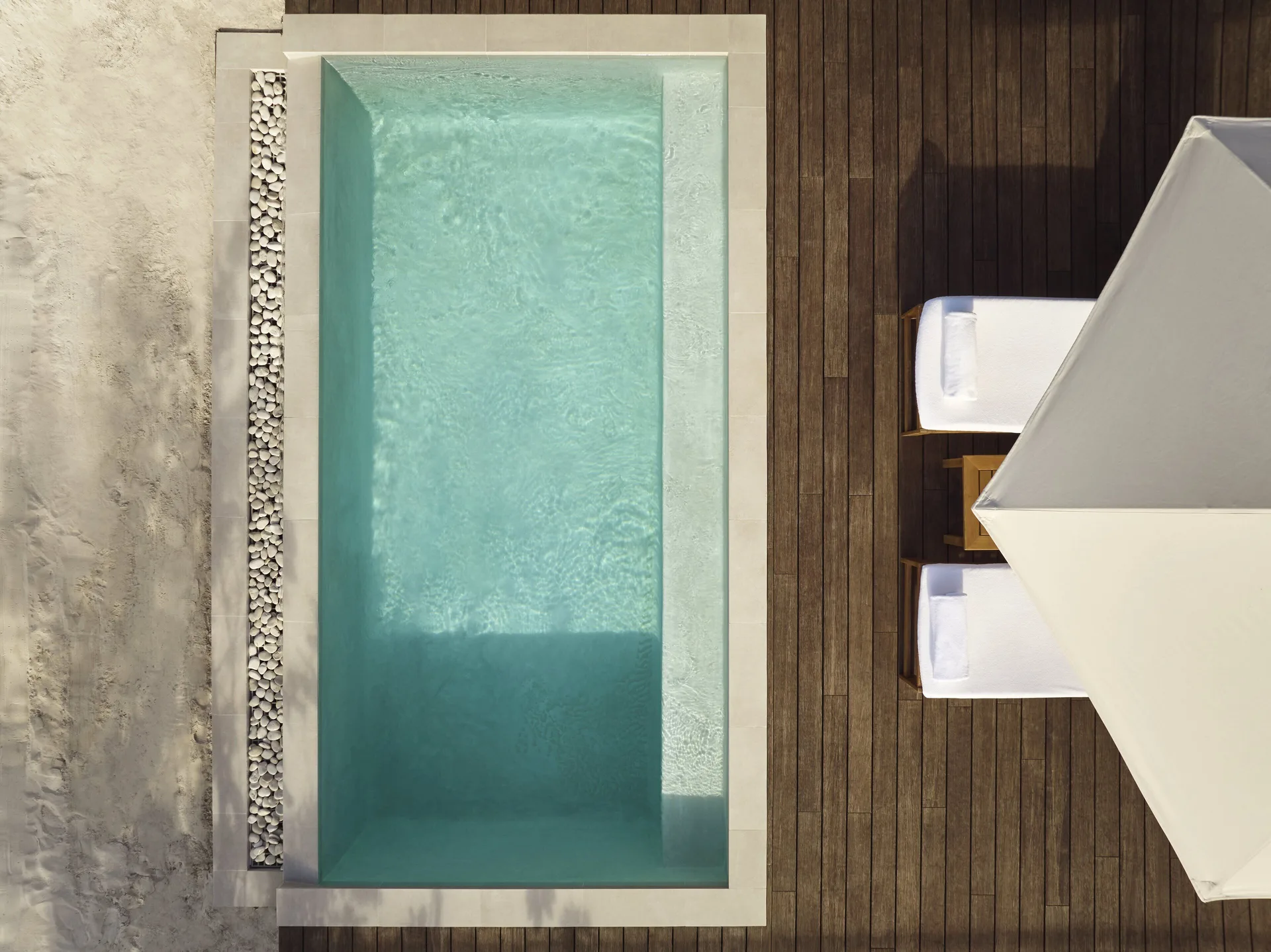 Beachfront Suite plunge pool and deck viewed from above at COMO Parrot Cay.