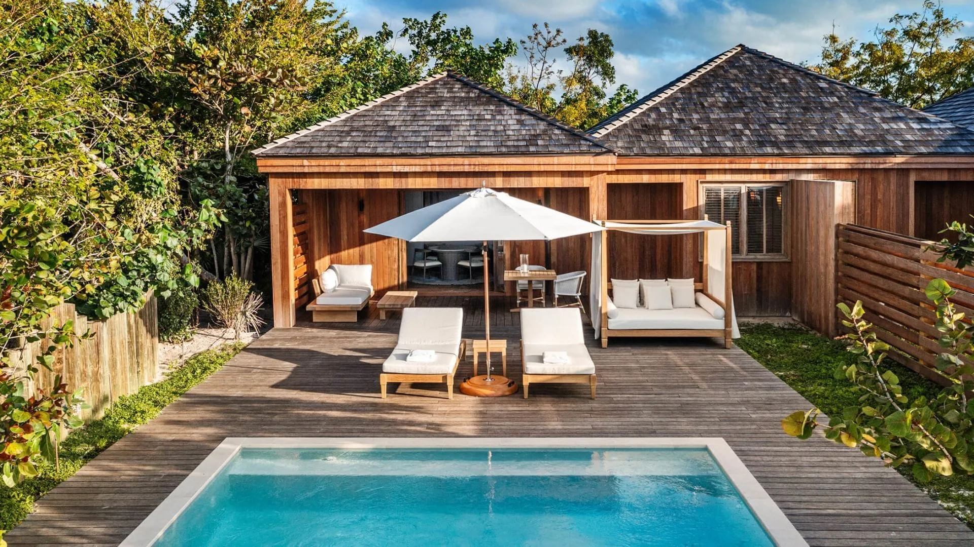 Beachfront Suite terrace with plunge pool and shaded seating at COMO Parrot Cay.