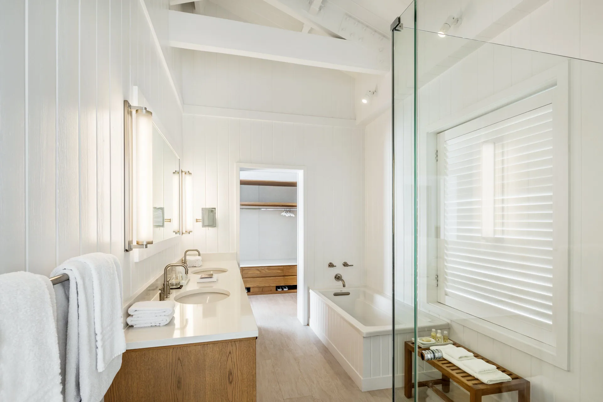 COMO Parrot Cay bathroom with double vanity, tub and glass shower at COMO Parrot Cay.