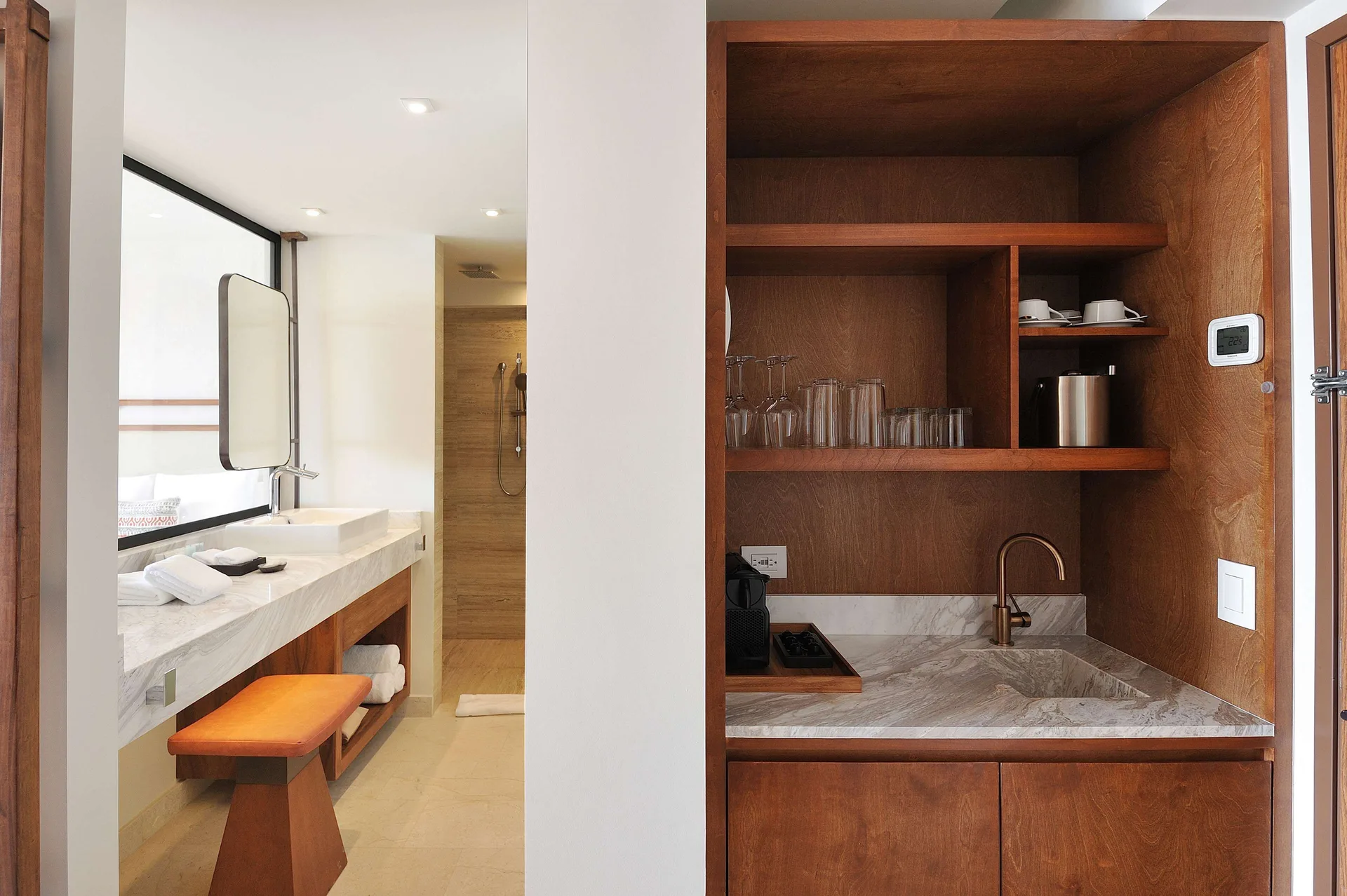 Infinity Sunset View room wet bar beside bathroom vanity at Corazón Cabo.