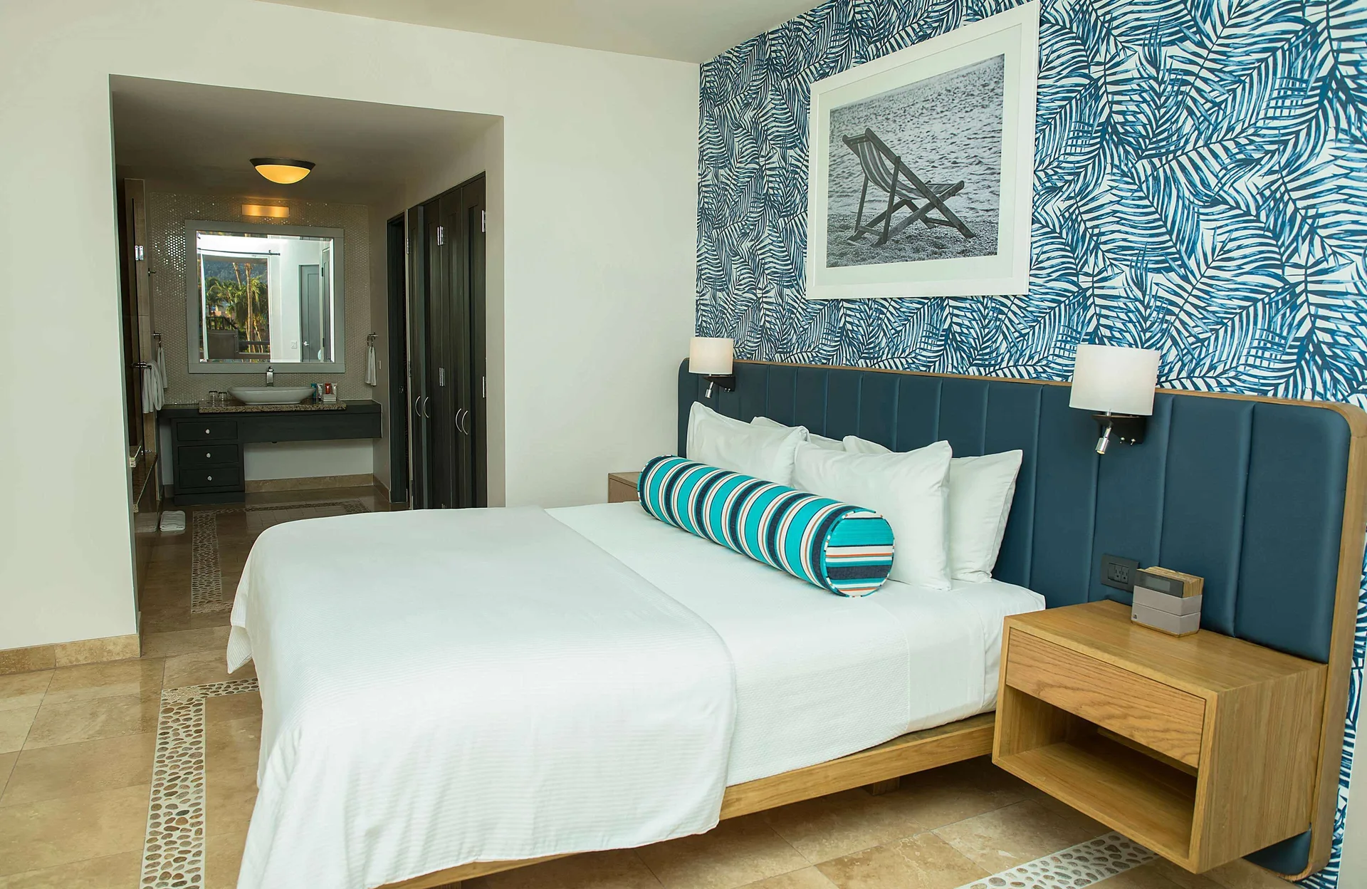 Three-bedroom suite king bedroom with vanity area visible at Corazón Cabo.