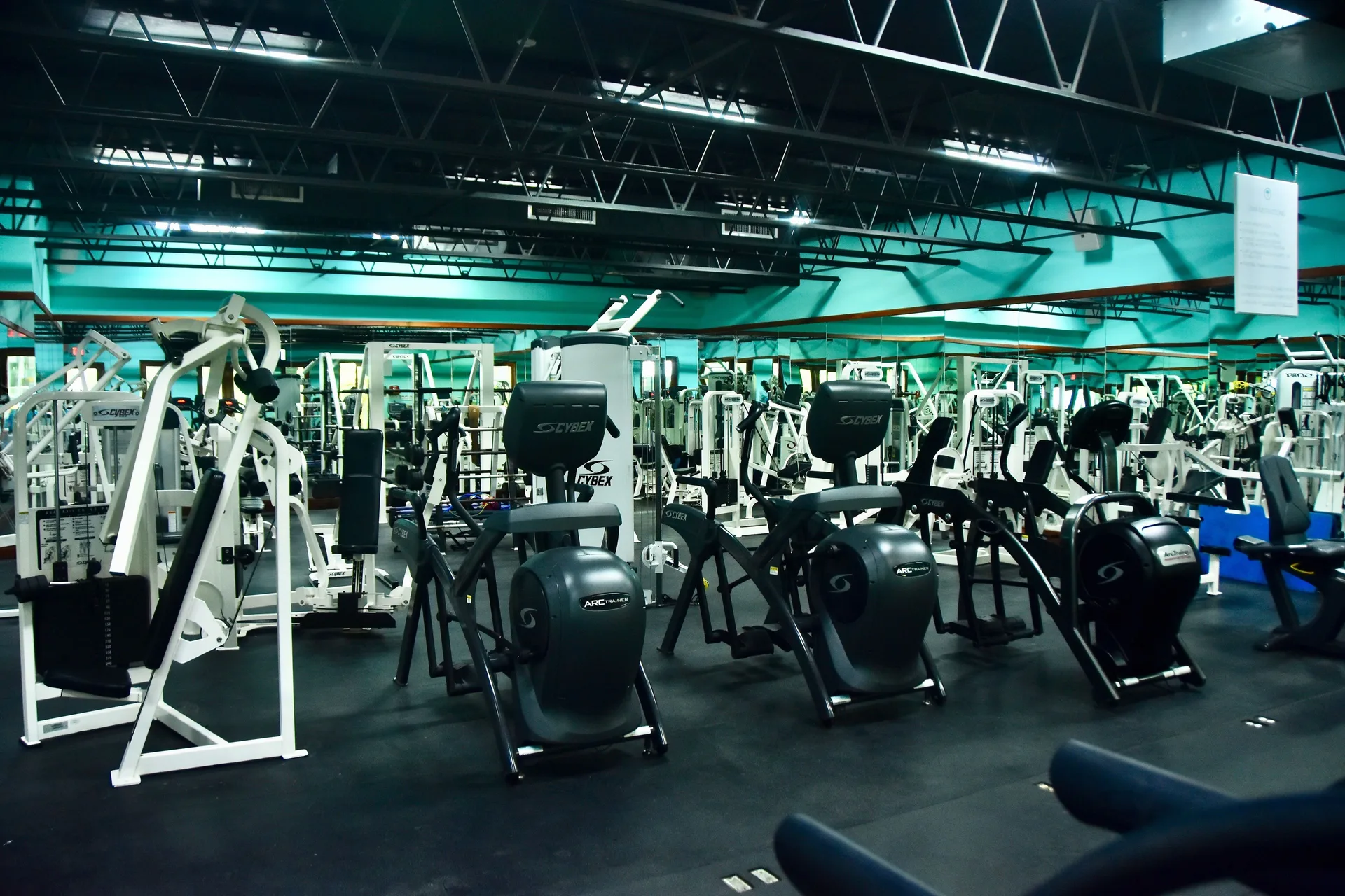 Fitness center with cardio machines and strength equipment at Couples Negril.