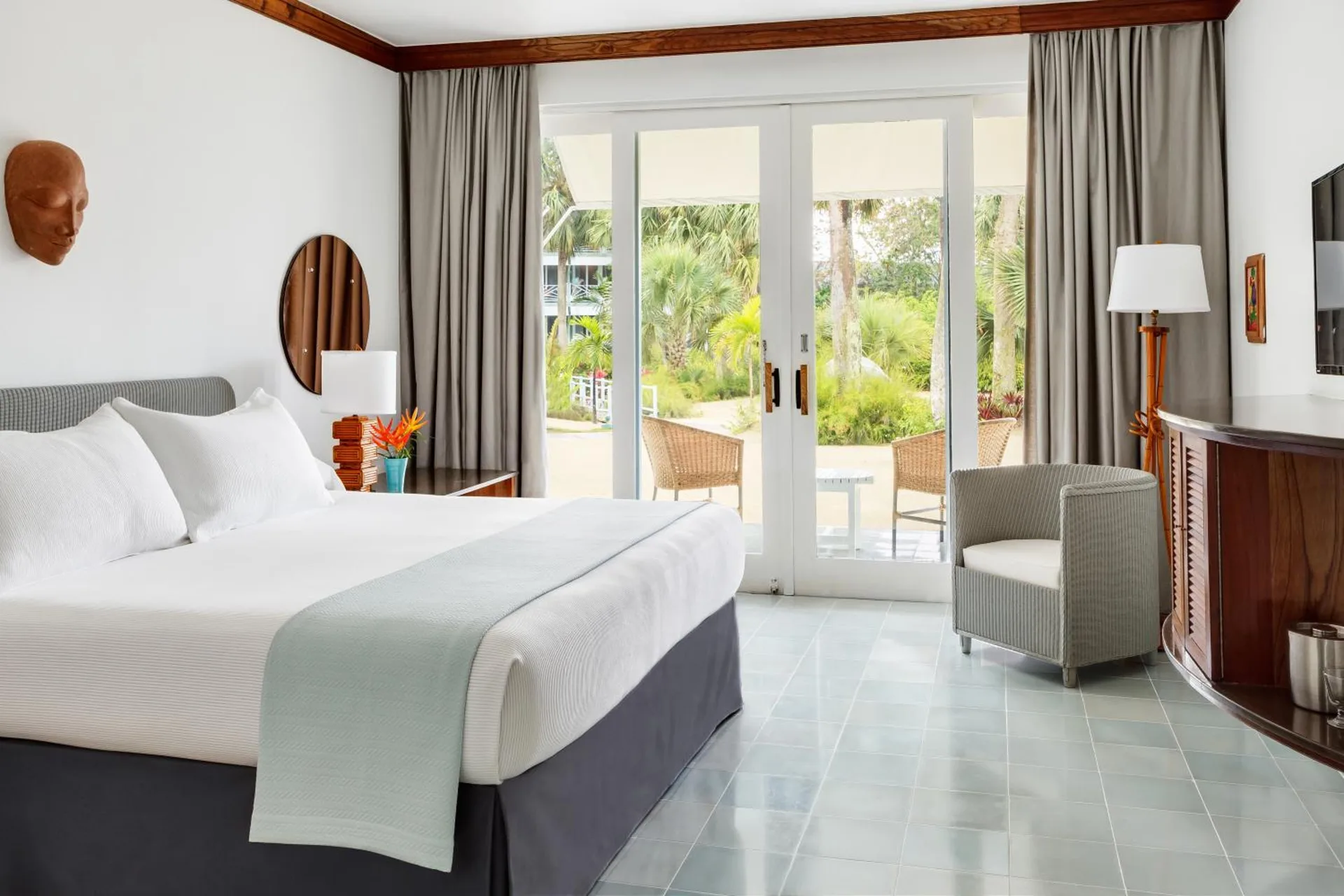 Deluxe Beachfront guest room with king bed and garden patio at Couples Negril.