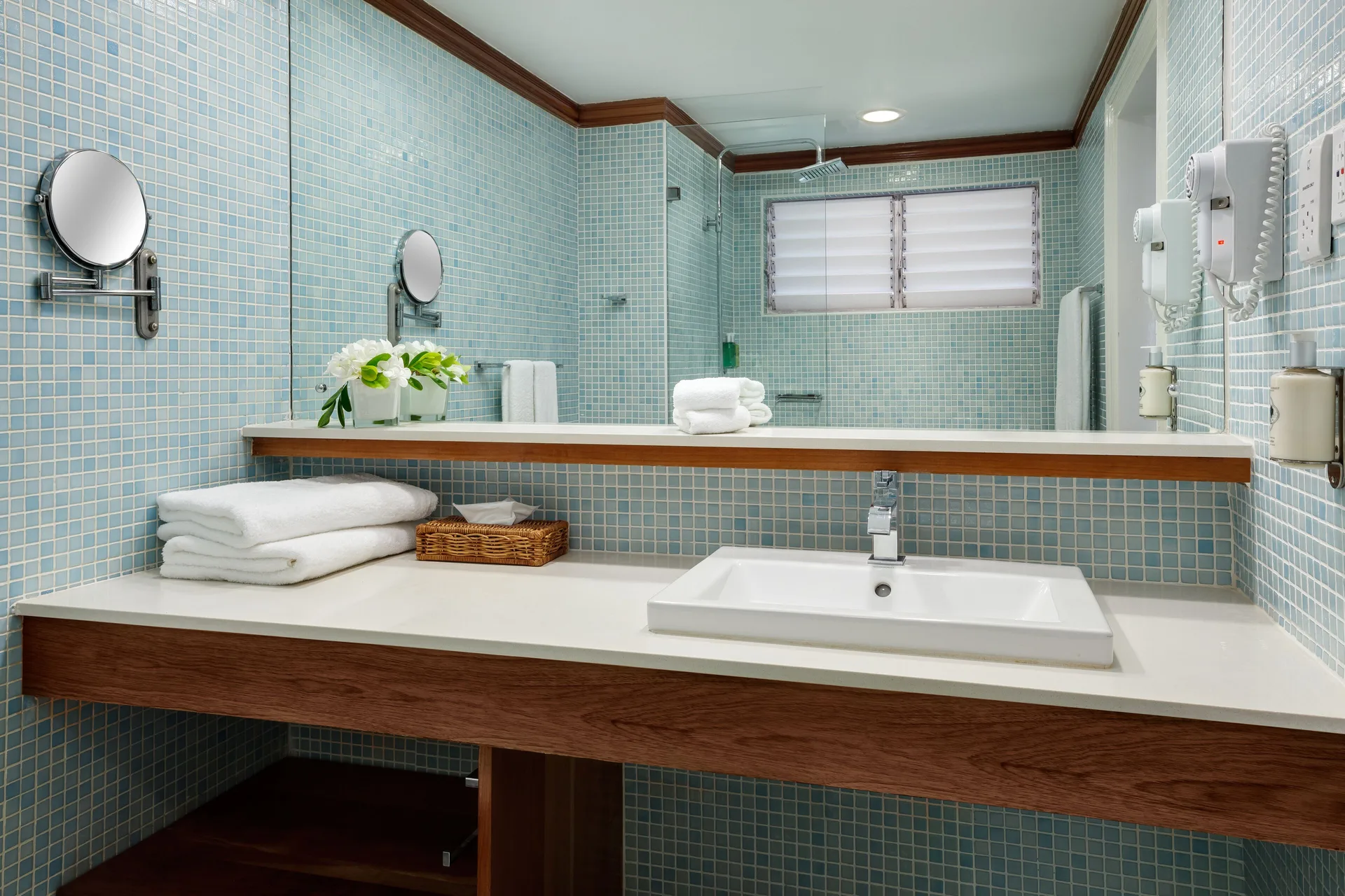 Deluxe Garden bathroom vanity with blue mosaic tile at Couples Negril.