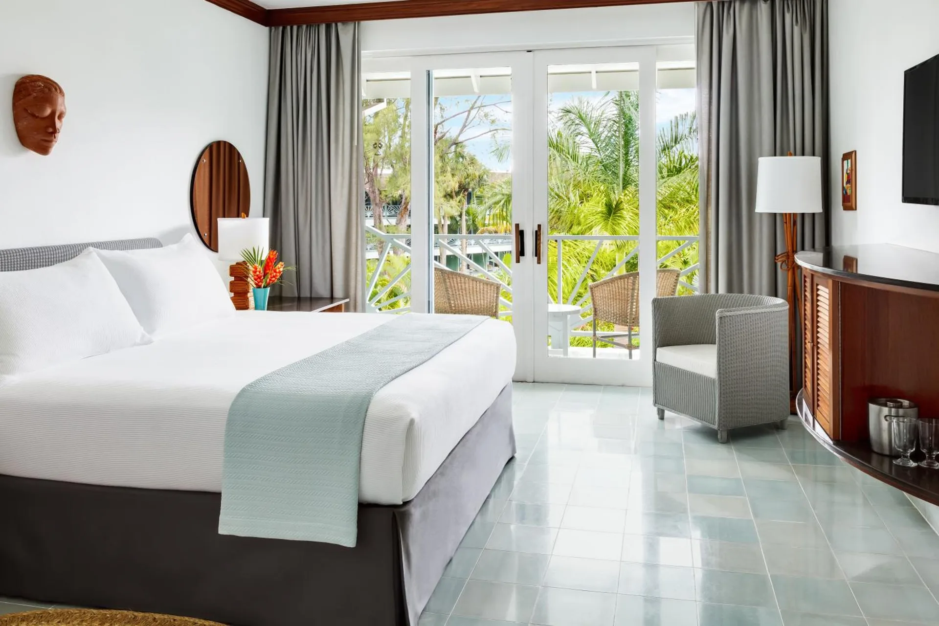 Deluxe Garden king bed room with balcony seating at Couples Negril.