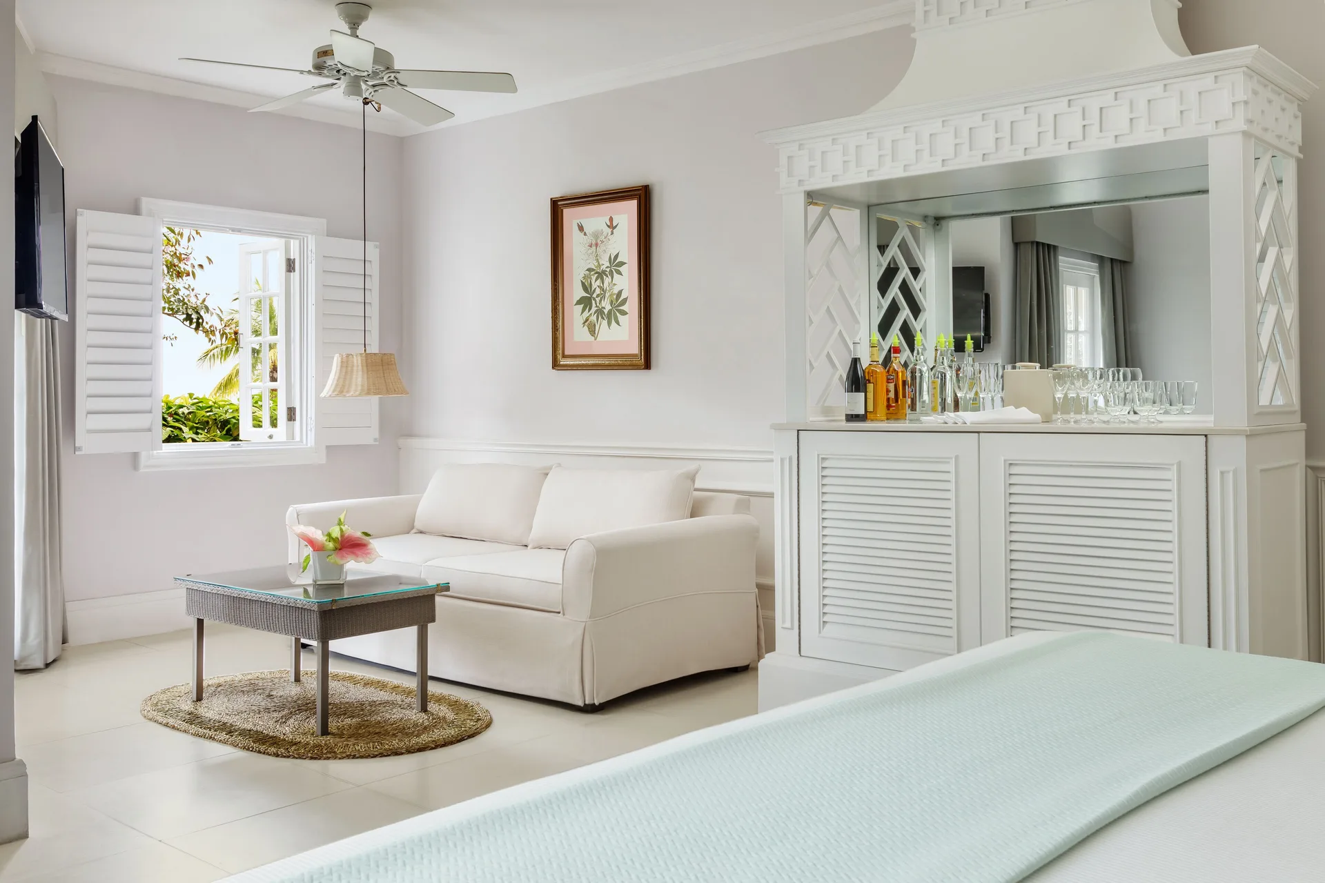 Beach Front Suite sitting area and refreshment cabinet at Couples Sans Souci.