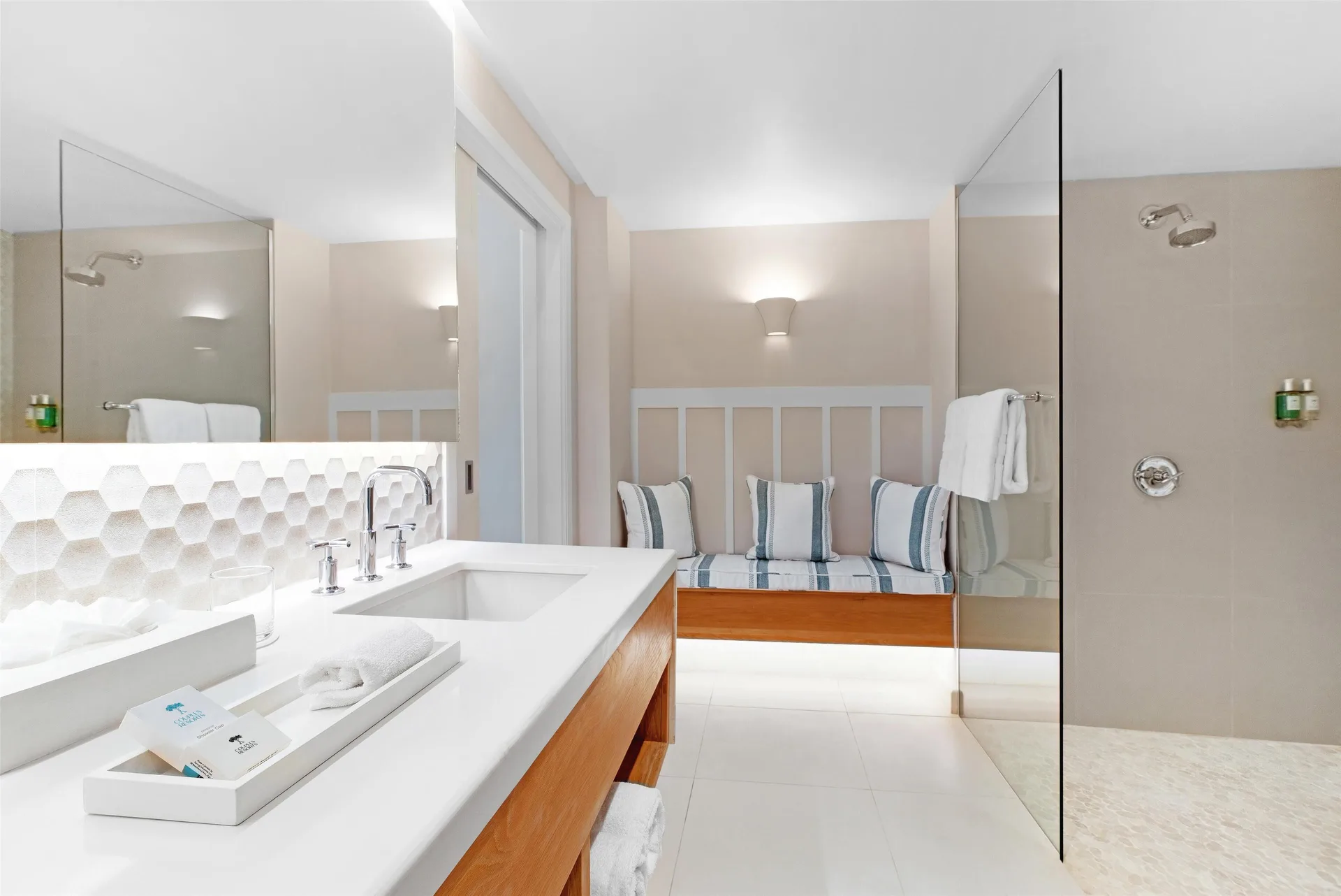 Penthouse Ocean Suite bathroom with vanity and walk-in shower at Couples Sans Souci.