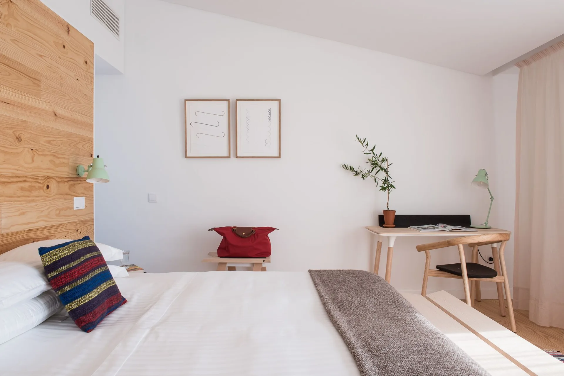 Studio guest room with bed and desk at Craveiral Farmhouse.