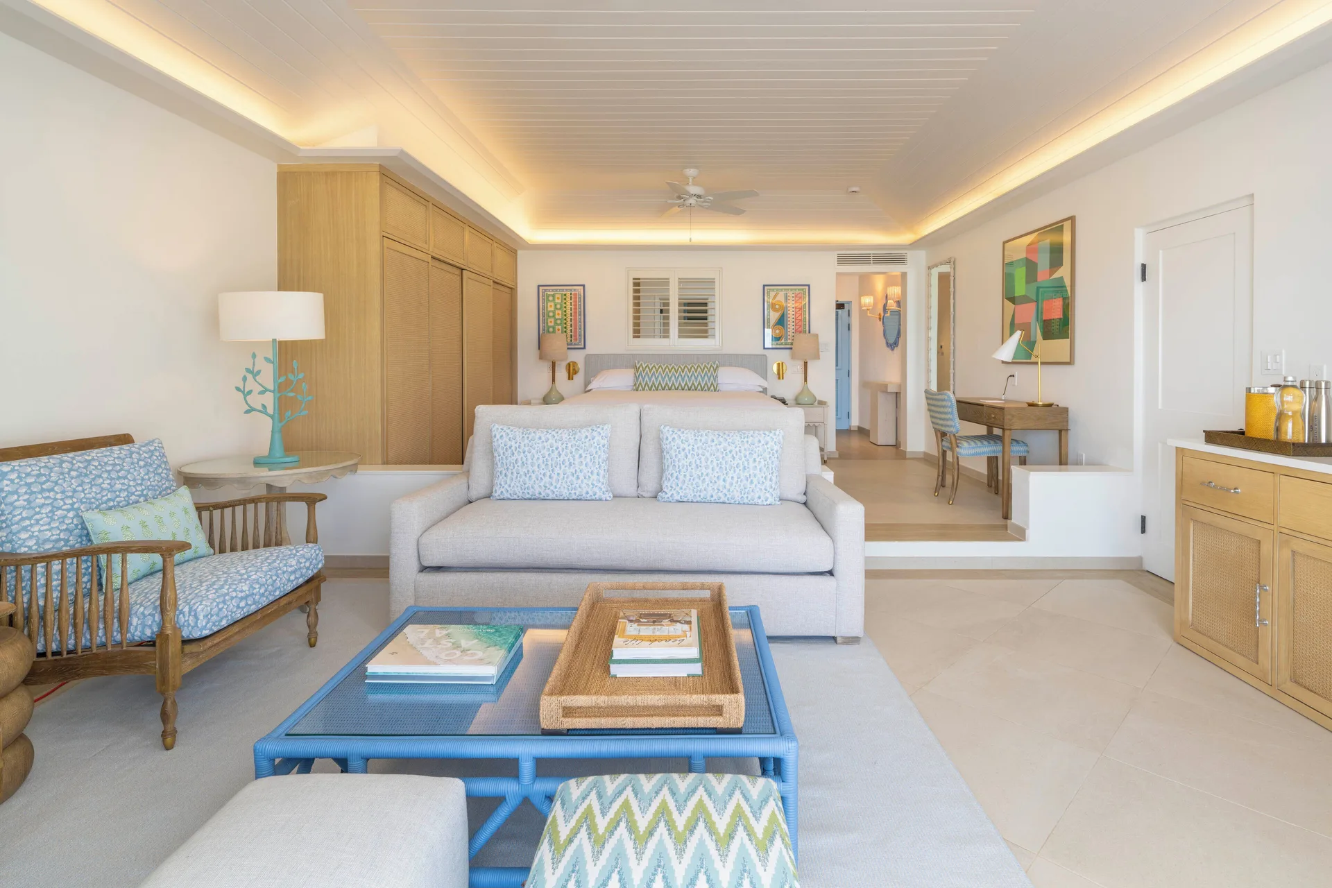 Junior Studio Suite with king bed and sitting area at Curtain Bluff Resort.
