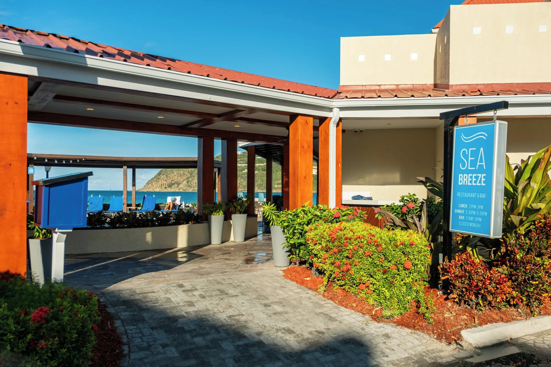 Seabreeze Restaurant & Bar entrance with ocean beyond at Divi Little Bay Beach Resort.