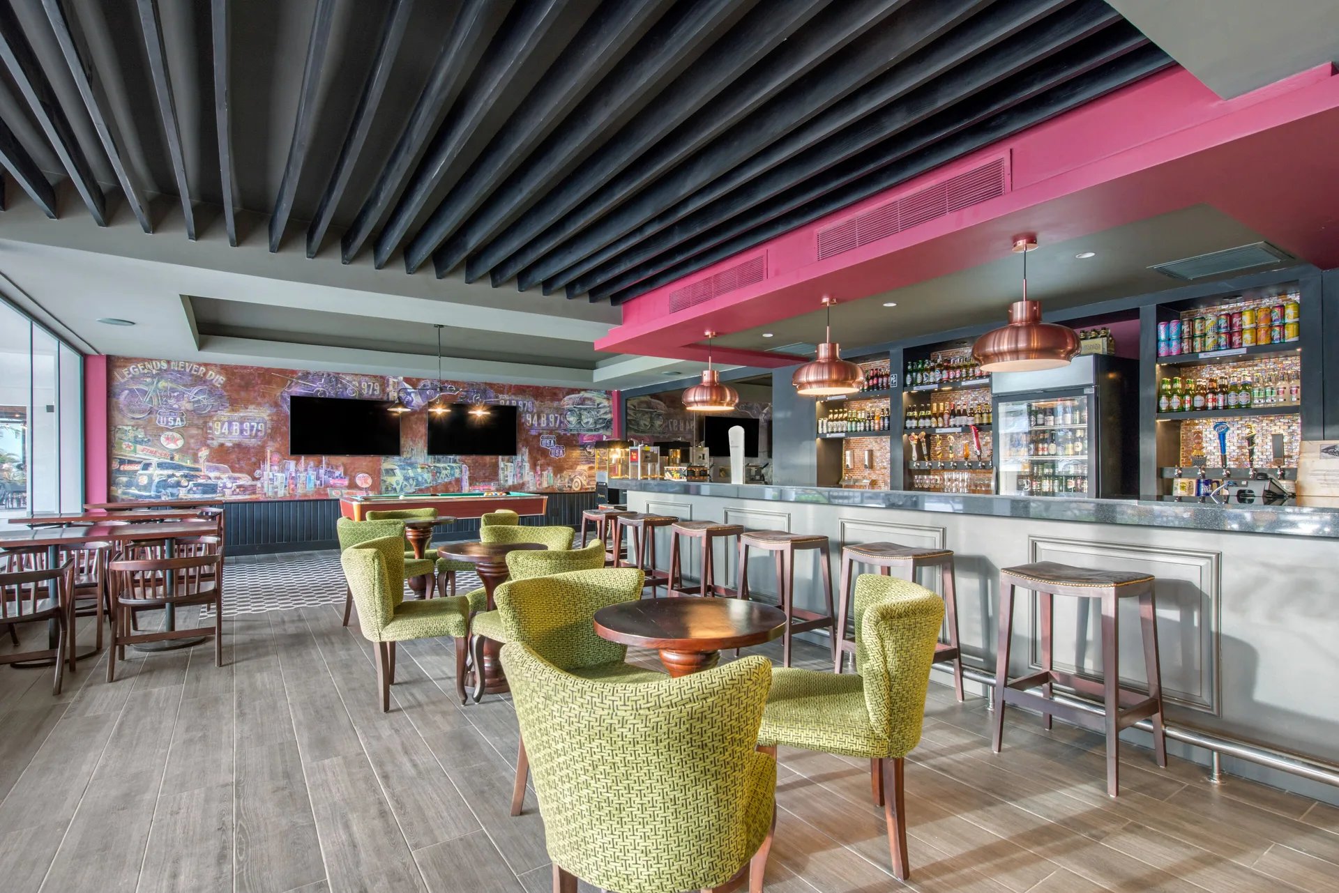 Beer house bar with green lounge chairs at Emotions by Hodelpa Puerto Plata.