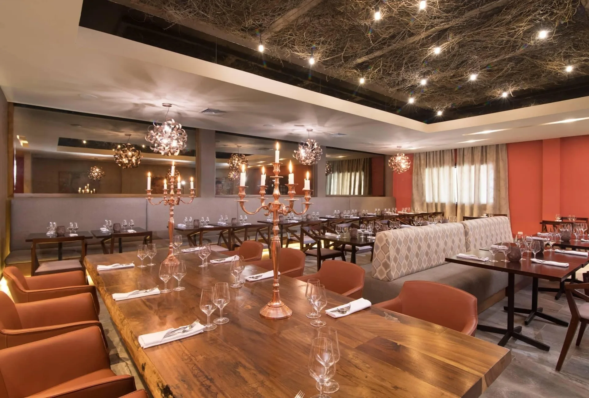 Restaurant dining room with candelabras at Emotions by Hodelpa Puerto Plata.