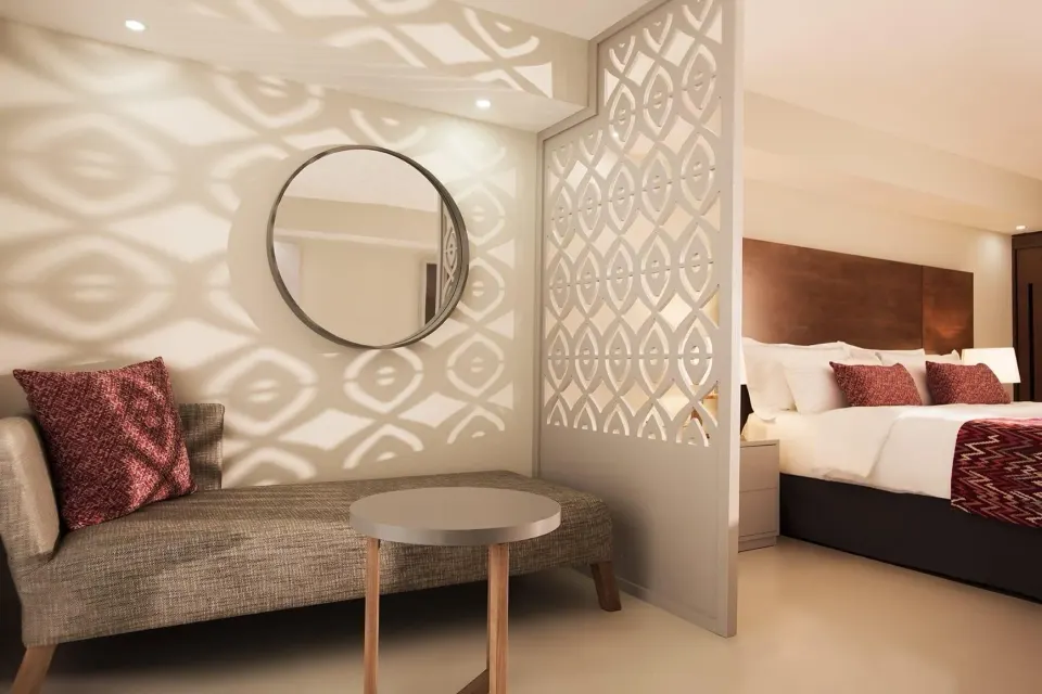 Adults Only Jr. Suite lounge and king bed at Emotions by Hodelpa Puerto Plata.