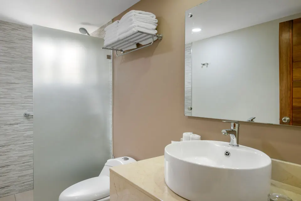 Superior Adults Only bathroom with vessel sink and glass shower at Emotions by Hodelpa Puerto Plata.