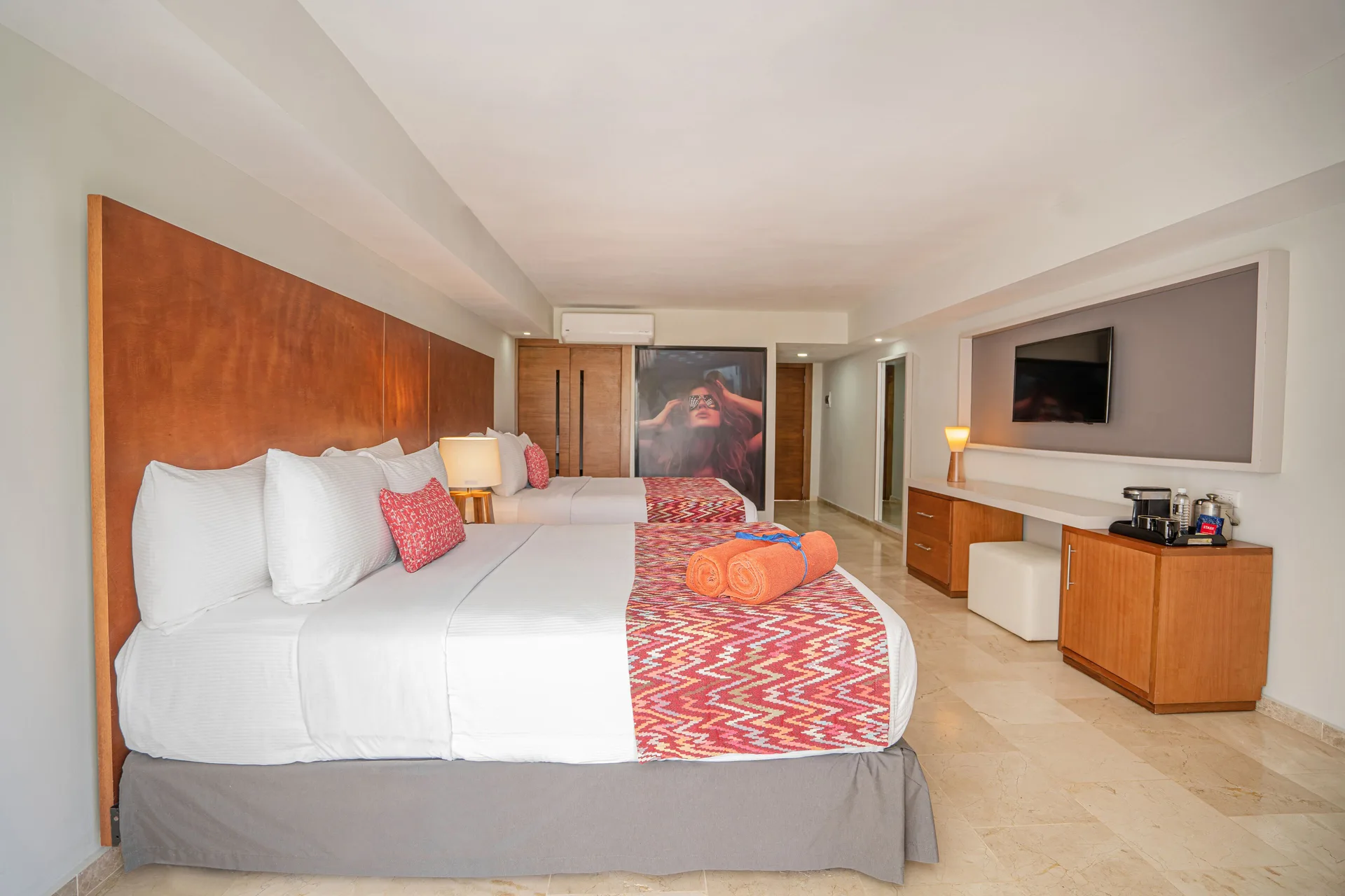 Superior Adults Only room with two beds, TV, and beverage area at Emotions by Hodelpa Puerto Plata.
