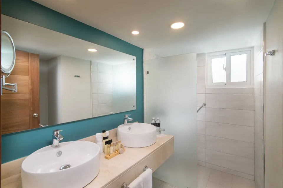 Swim Out Room 18+ bathroom with double vessel sinks at Emotions by Hodelpa Puerto Plata.
