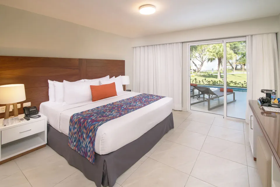 Swim Out Room 18+ king bed and terrace at Emotions by Hodelpa Puerto Plata.