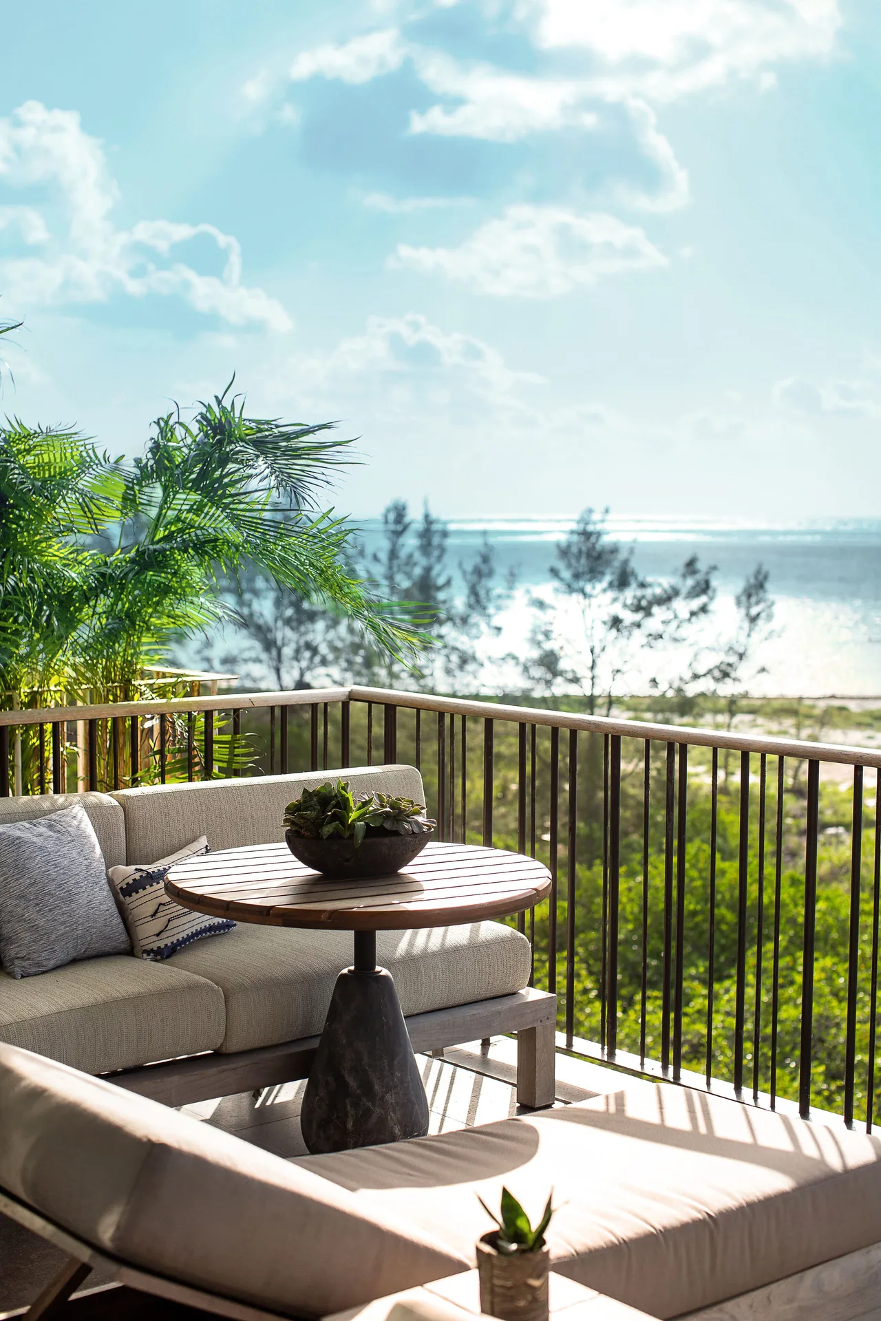 Mangrove Studio terrace seating with water view at Etéreo, Auberge Collection.