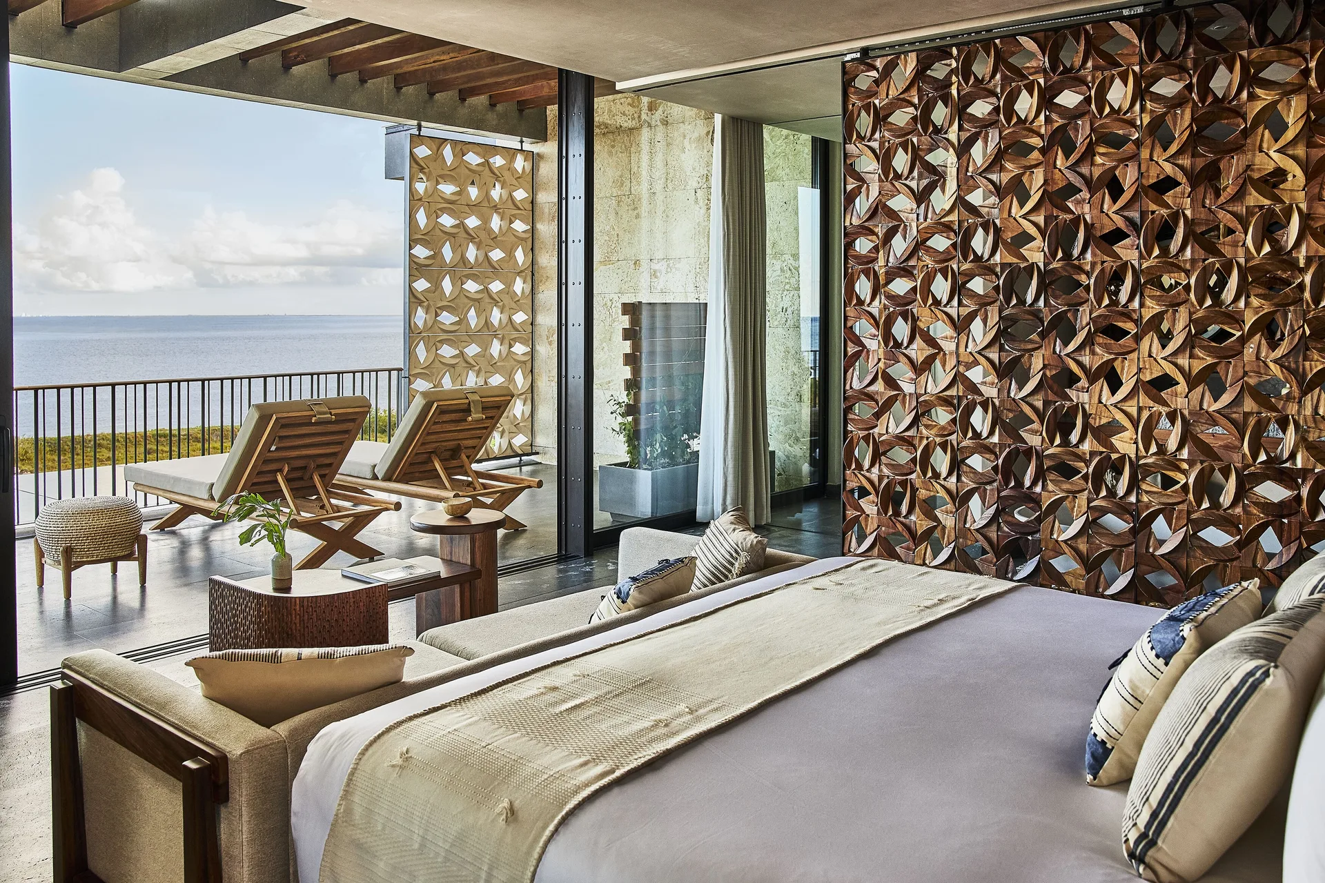 Ocean Studio king bed and terrace facing the sea at Etéreo, Auberge Collection.