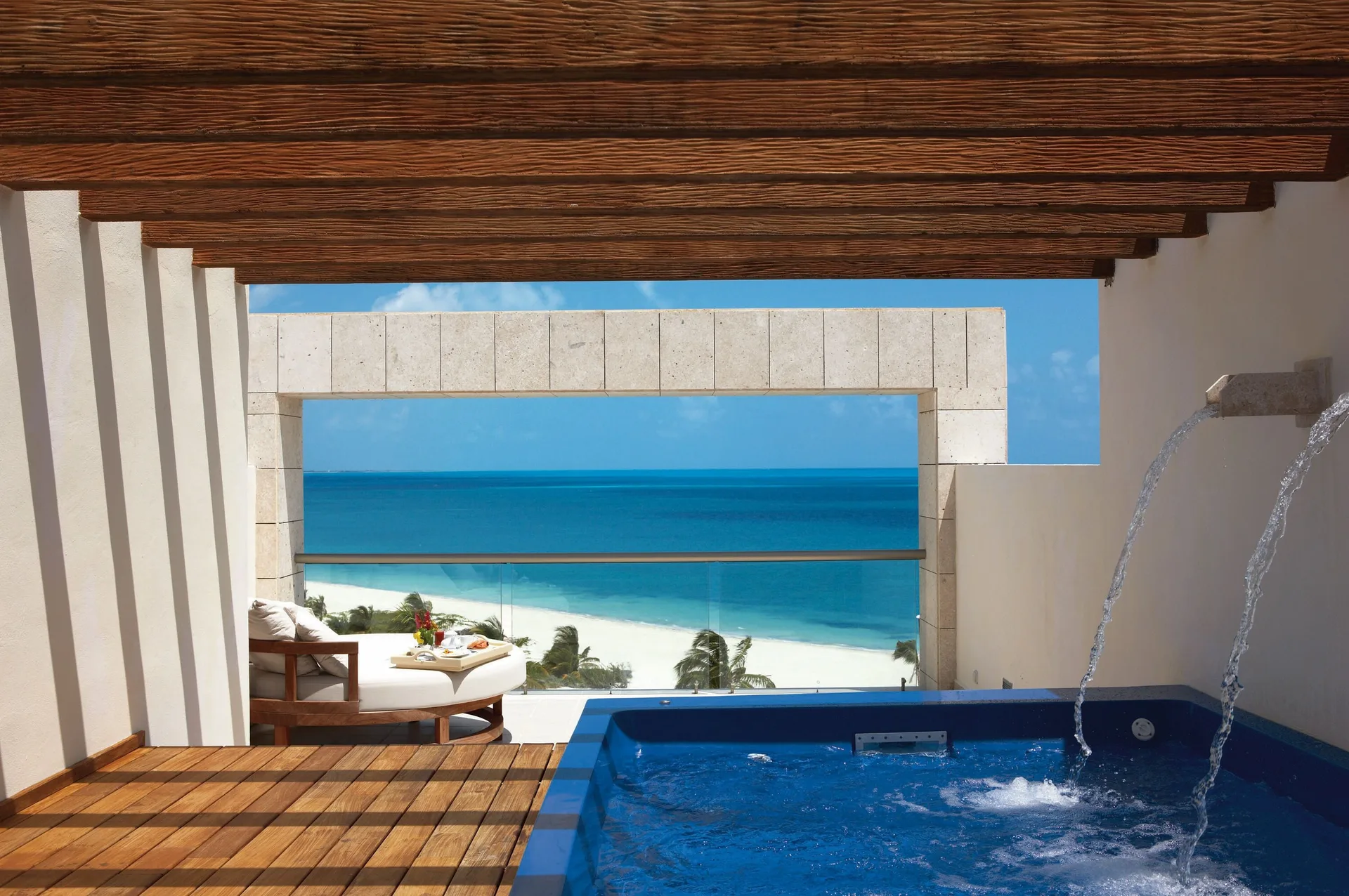 Oceanfront rooftop terrace suite pool and beach view at Excellence Playa Mujeres.