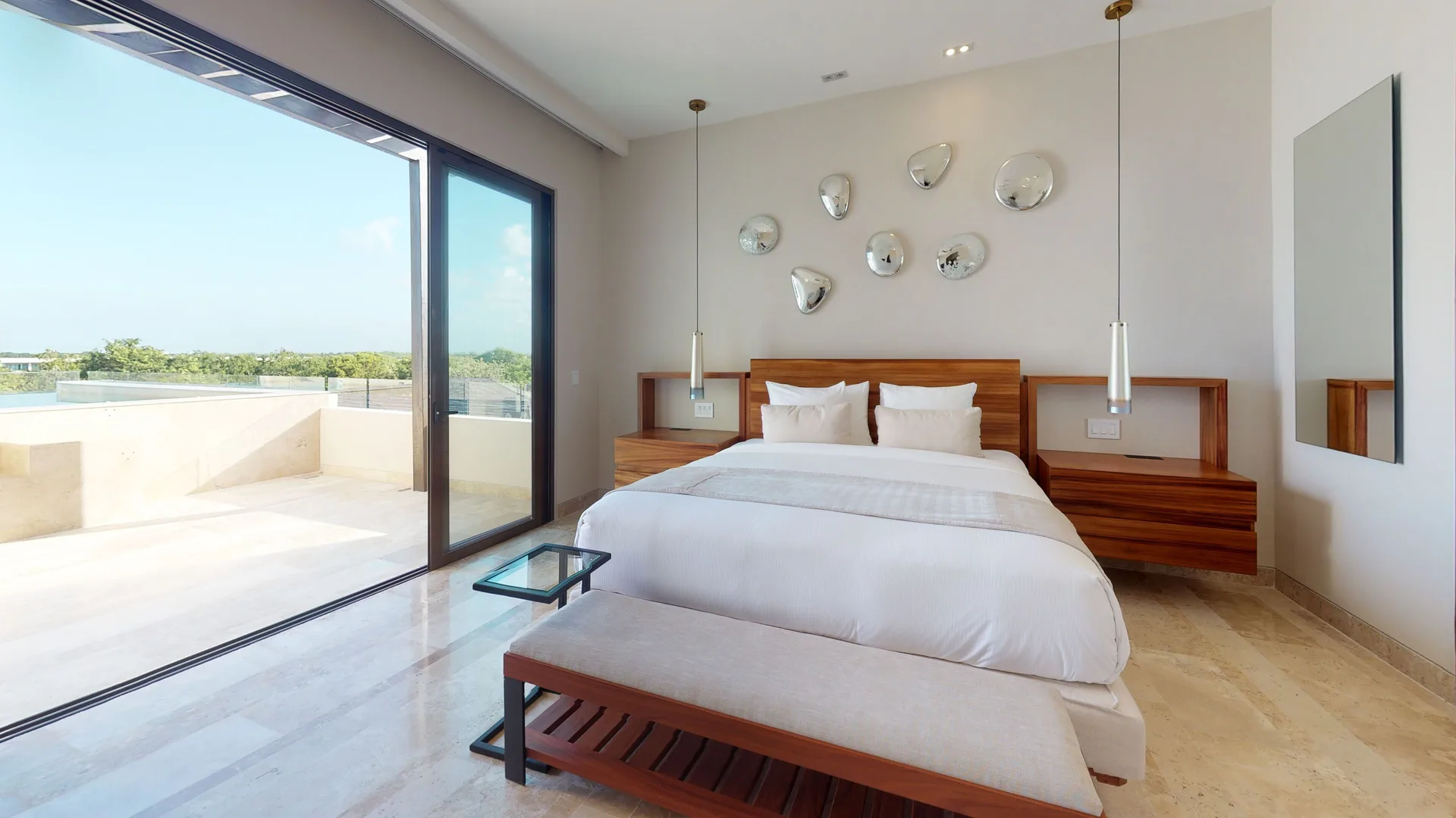 King bedroom with terrace at Fairmont Heritage Place Mayakoba.