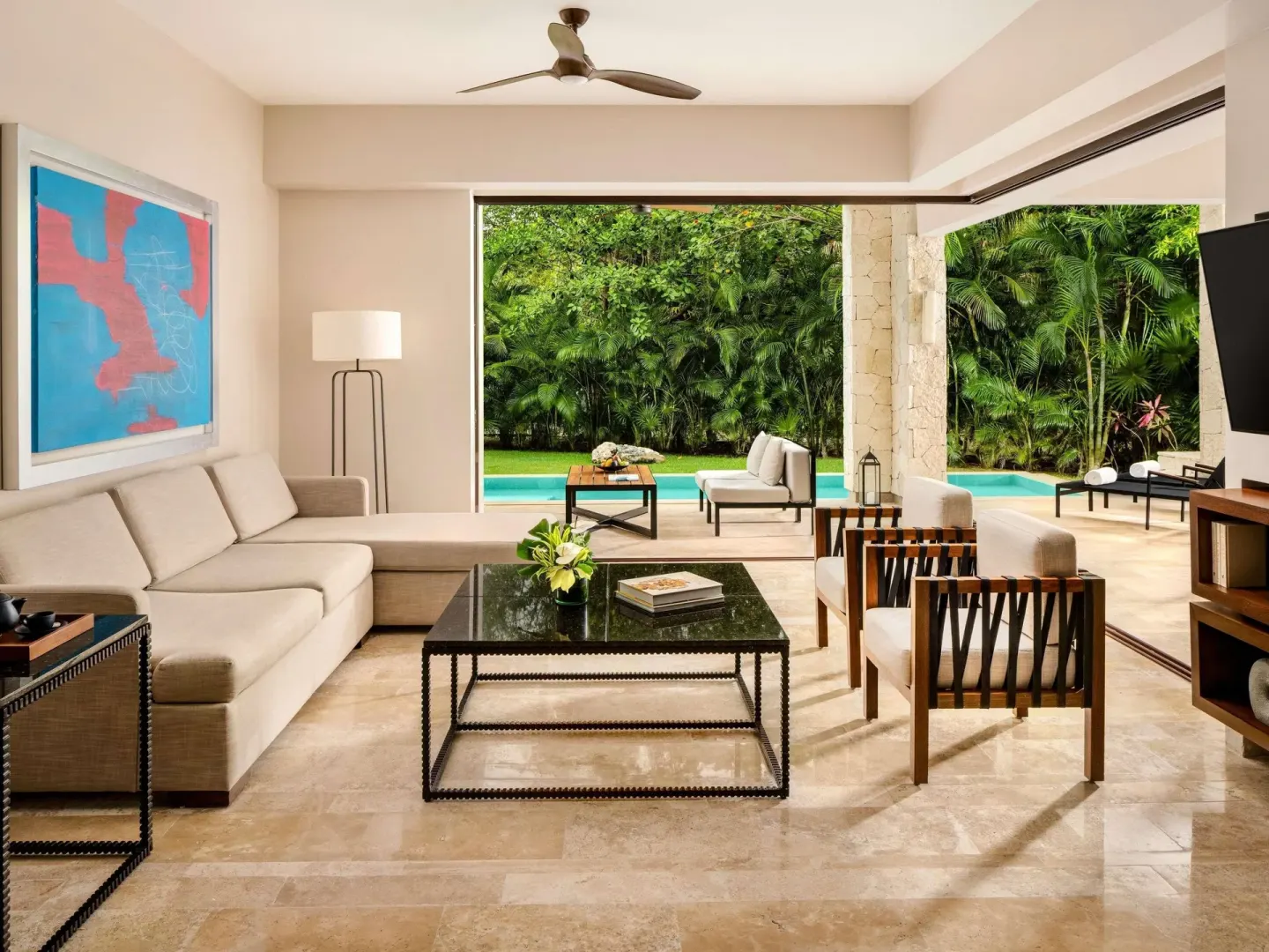Garden villa living room with terrace and pool at Fairmont Heritage Place Mayakoba.