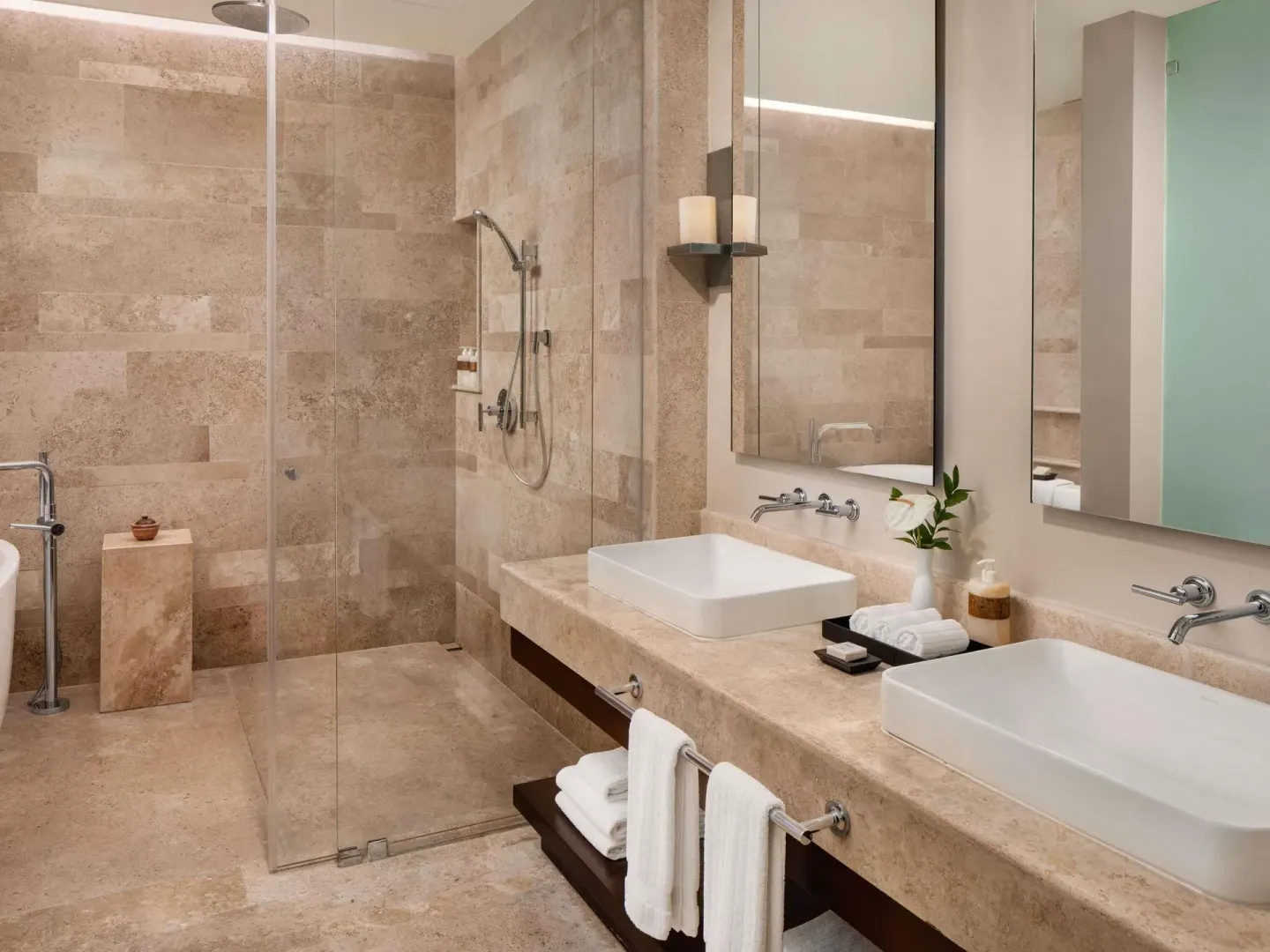 Villa bathroom with double sinks and glass shower at Fairmont Heritage Place Mayakoba.