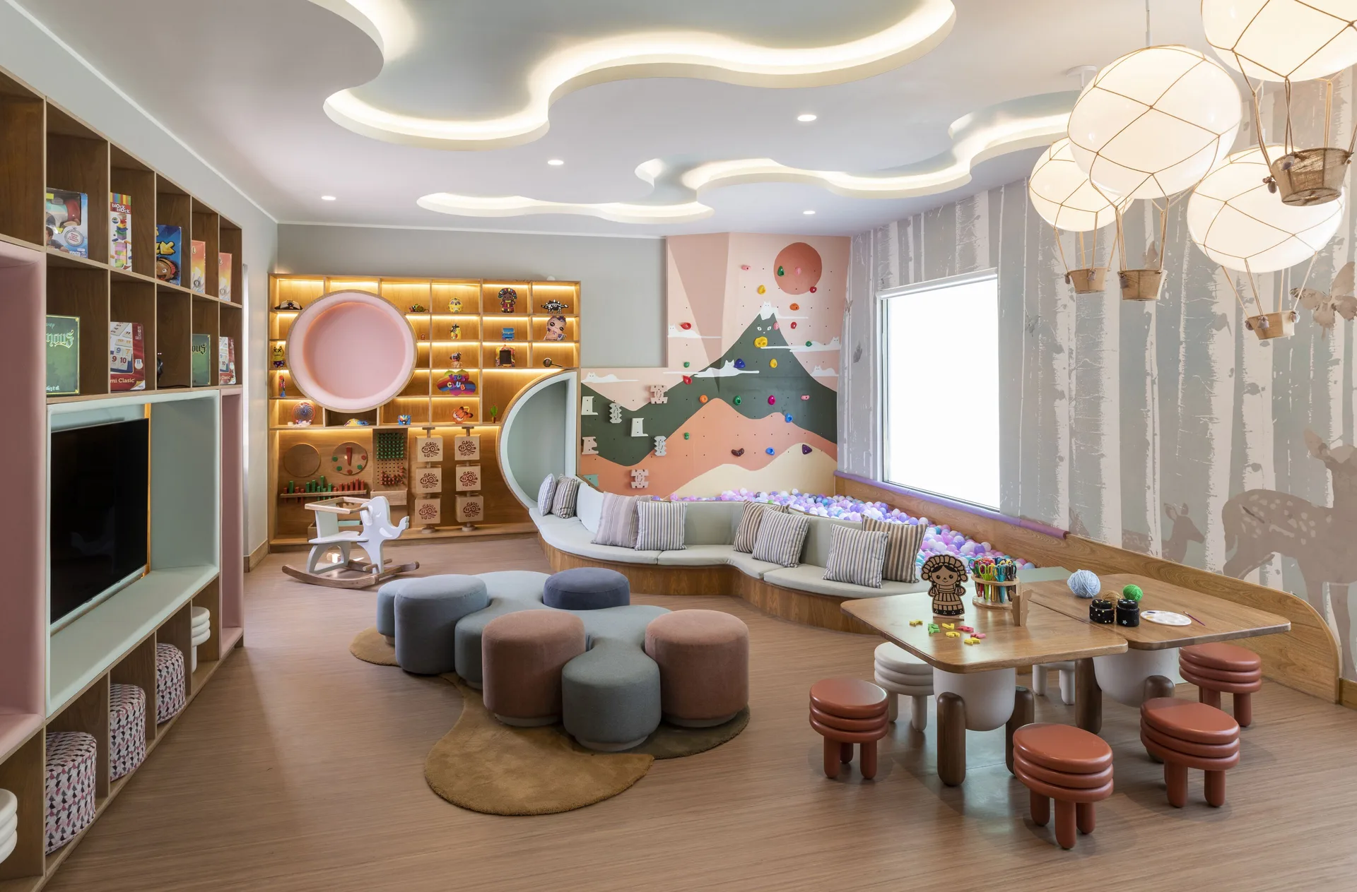 Children's playroom with toys, stools, games, and playful decor at Fairmont Mayakoba.