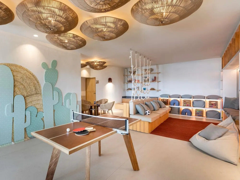 Children’s playroom with table tennis and lounge seating at Fairmont Mayakoba.