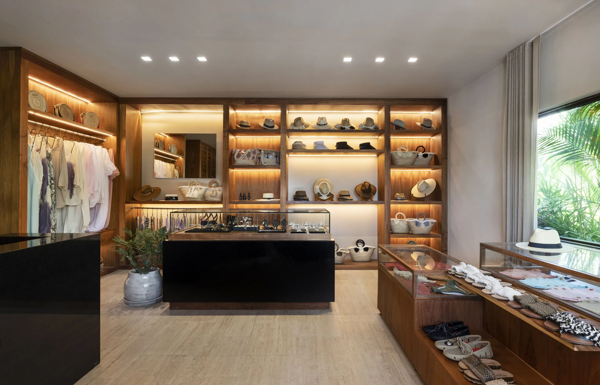 Boutique shelves with clothing, hats and accessories at Fairmont Mayakoba.